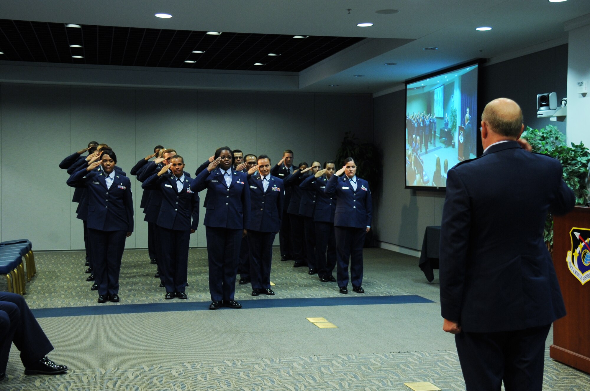 Col. (Dr.) Paul J. Hoerner, incoming 61st Medical Squadron commander, accepts his first salute from his medical personnel during an Assumption of Command ceremony at the Gordon Conference Center June 26. As the 61st MDS commander, Hoerner is responsible for ensuring more than 1,200 active duty personnel assigned to the Space and Missile Systems Center at Los Angeles Air Force Base in El Segundo, Calif. are medically fit and ready for contingency (natural disasters and wartime) operations. Additionally, he commands a staff of 178 active duty, government civilians and contract medical staff providing care for more than 171,000 eligible patients across the greater Los Angeles metropolitan area. (U.S. Air Force photo/Van Ha)