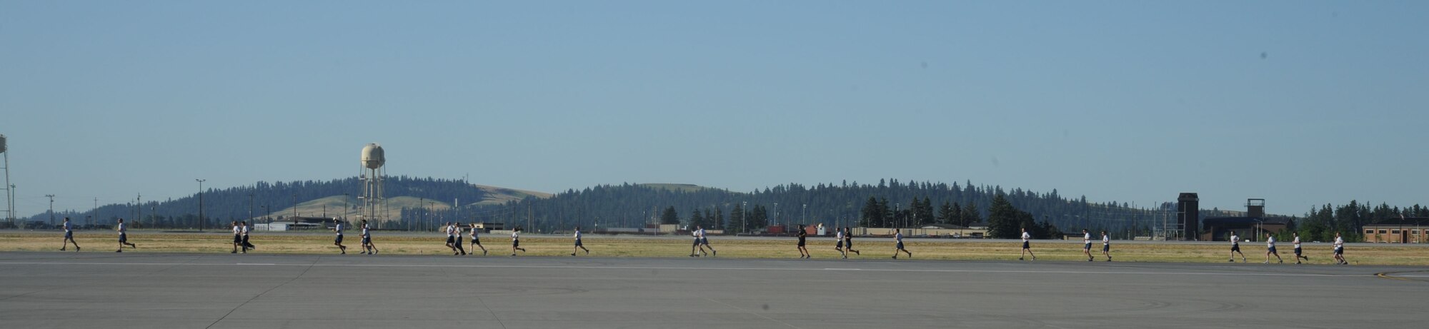 Airmen near completion of the monthly wing run June 26, 2015, at Fairchild Air Force Base, Wash. The course went around the flightline. (U.S. Air Force photo/Senior Airman Sam Fogleman)