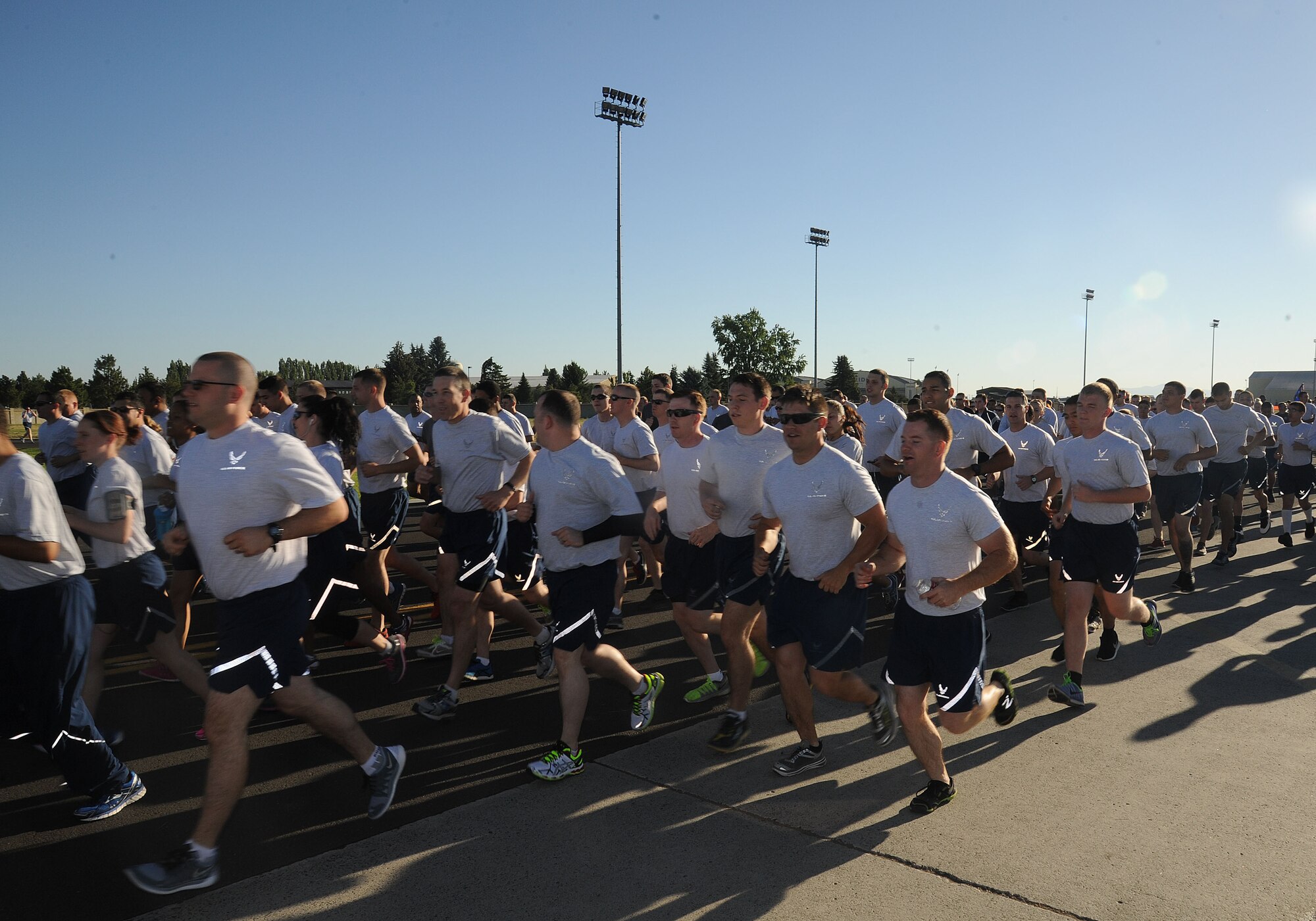 Airmen begin the monthly wing run June 26, 2015, at Fairchild Air Force Base, Wash. The course went in a loop around the flightline. Wing runs enhance unit cohesion through a shared enterprise. (U.S. Air Force photo/Senior Airman Sam Fogleman)