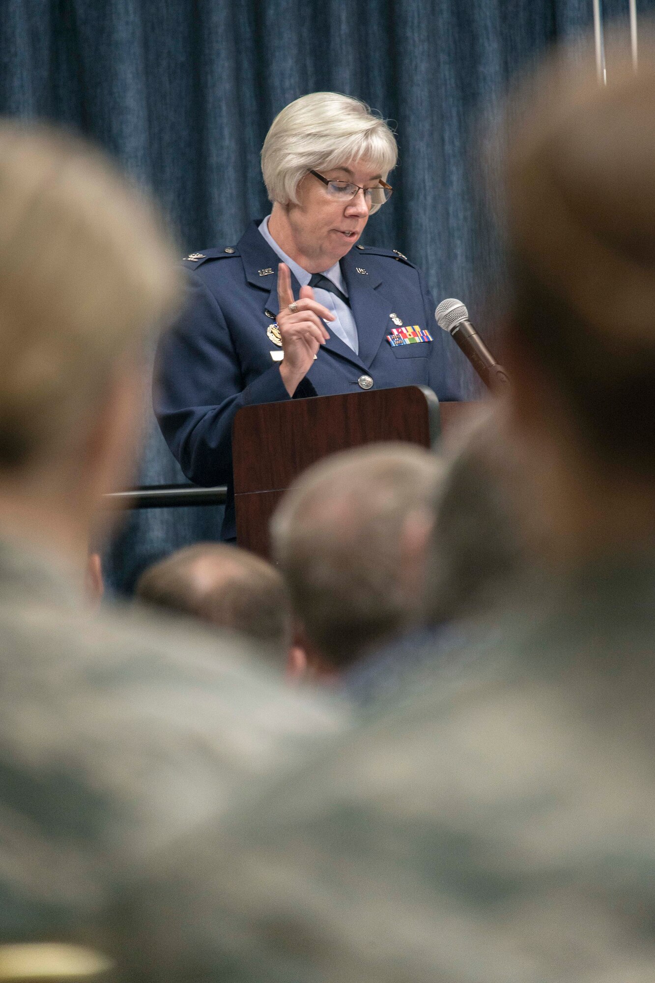 Col. Margaret Carey, 92nd Medical Group commander, thanks her Airmen for their dedication to the mission and teamwork supporting outgoing 92nd Medical Support Squadron commander, Lt. Col. Richard Broyer, during the 92nd MDSS change of command ceremony June 26, 2015, at Fairchild Air Force Base, Wash. The change of command ceremony is an official, formal and brief ceremony that is the military’s way of bestowing command responsibility of a unit from one officer to another. This ceremony formalizes the change of command by the passing of the symbol of command, the squadron guidon, from the relinquishing commander to the gaining commander. (U.S. Air Force photo/Staff Sgt. Benjamin W. Stratton)