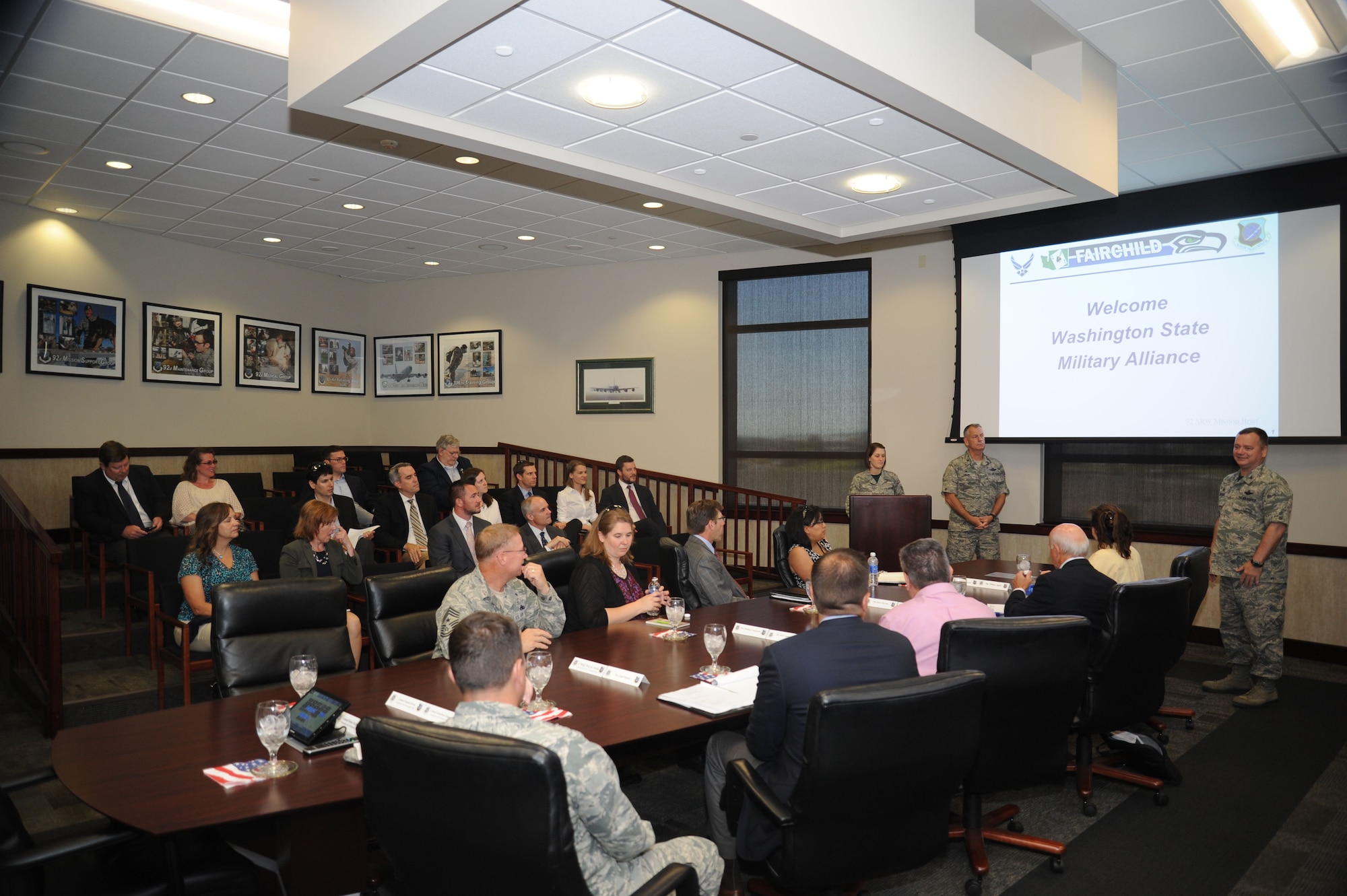 Col. Brian McDaniel, 92nd Air Refueling Wing commander, and Col. Daniel Swain, 141st ARW commander, provide mission briefings to visiting members of the Washington State Military Alliance June 26, 2015, at Fairchild Air Force Base, Wash. (U.S. Air Force photo/Senior Airman Sam Fogleman)