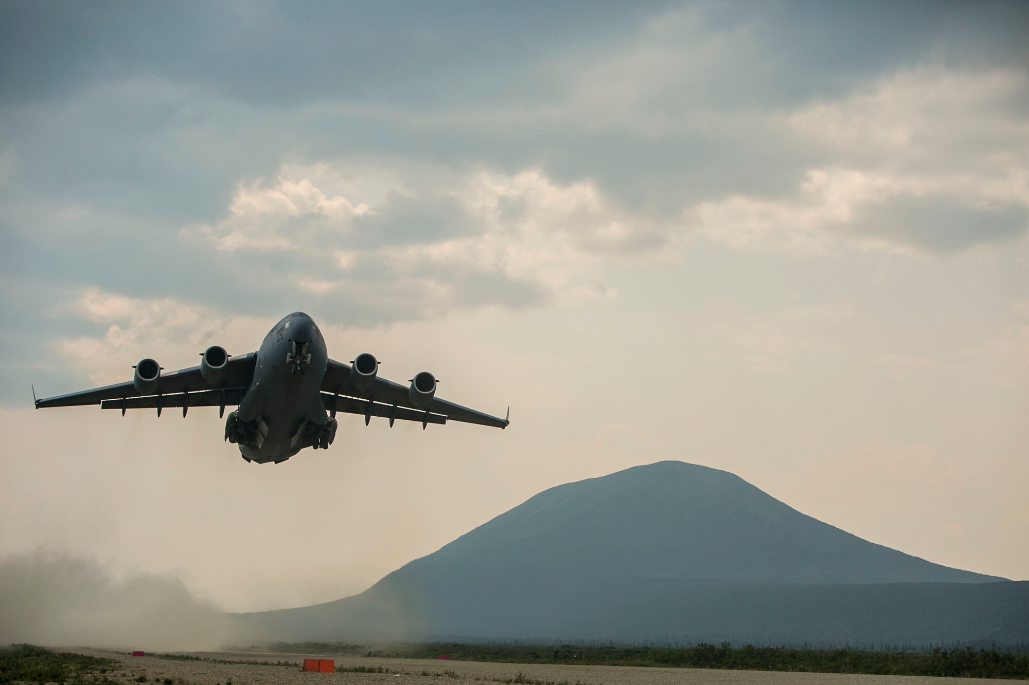 EIELSON AIR FORCE BASE, Alaska – A U.S. Air Force C-17 Globemaster III transport aircraft with the 249th Airlift Squadron takes off of an assault landing strip in Donnelly Training Area, Alaska, as part of Exercise Northern Edge, June 25, 2015. Northern Edge 2015 is Alaska’s premier joint training exercise designed to practice operations, tactics, techniques and procedures as well as enhance interoperability among the services. Thousands of Airmen, Soldiers, Sailors, Marines and Coast Guardsmen from active duty, reserve and National Guard units are involved. (U.S. Marine Corps photo by Cpl. Tyler S. Giguere/Released)
