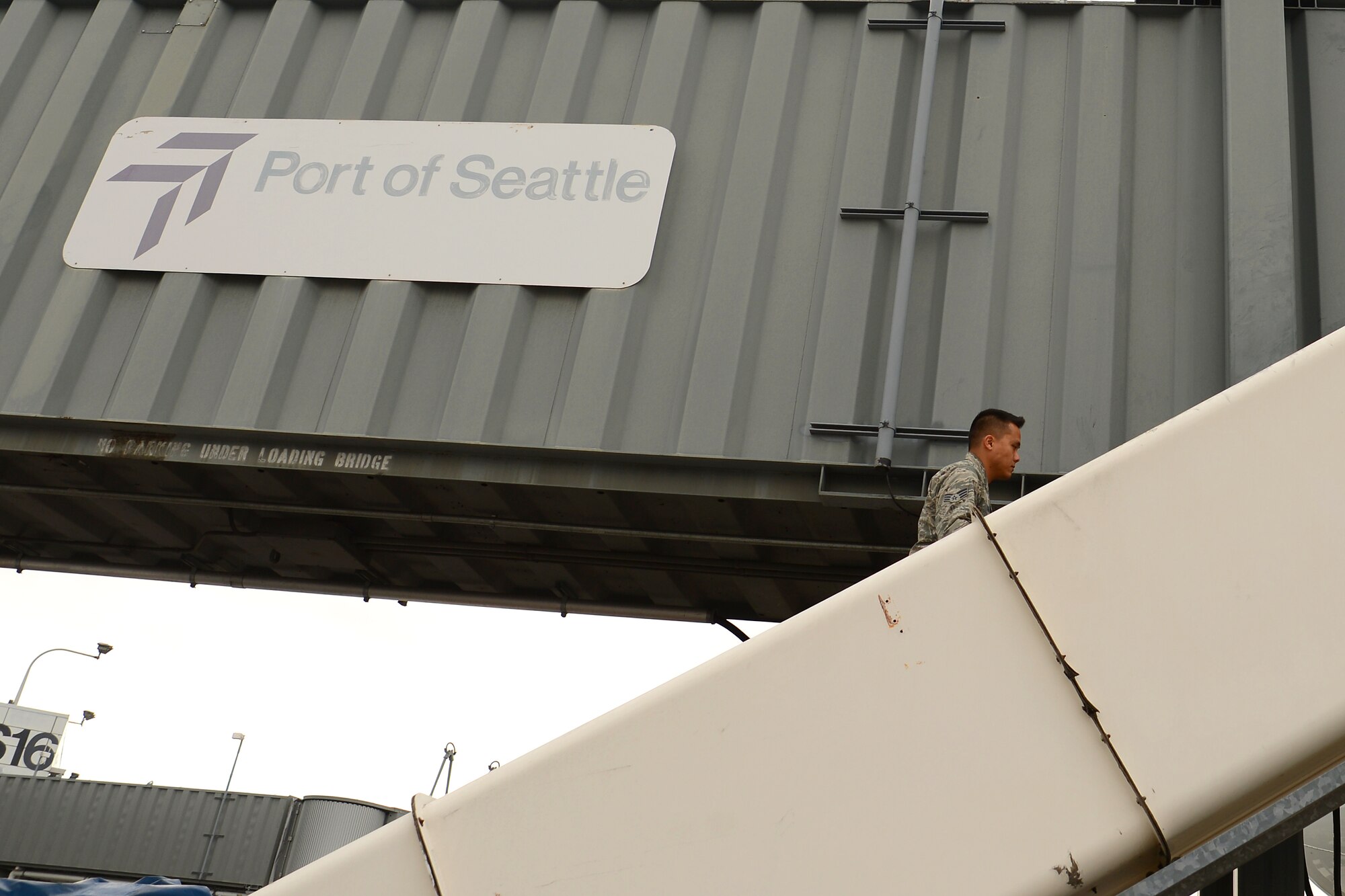 Senior Airman Pao Khang, 62nd Aerial Port Squadron contracting officer representative, inspects a flight prior to departure, June 16, 2015, at SeaTac Airport, Wash. When Khang or the other Airmen from the 62nd APS, assigned to SeaTac discovers a problem he logs it and notifies the contractor for repair. (U.S. Air Force photo by Staff Sgt. Tim Chacon)