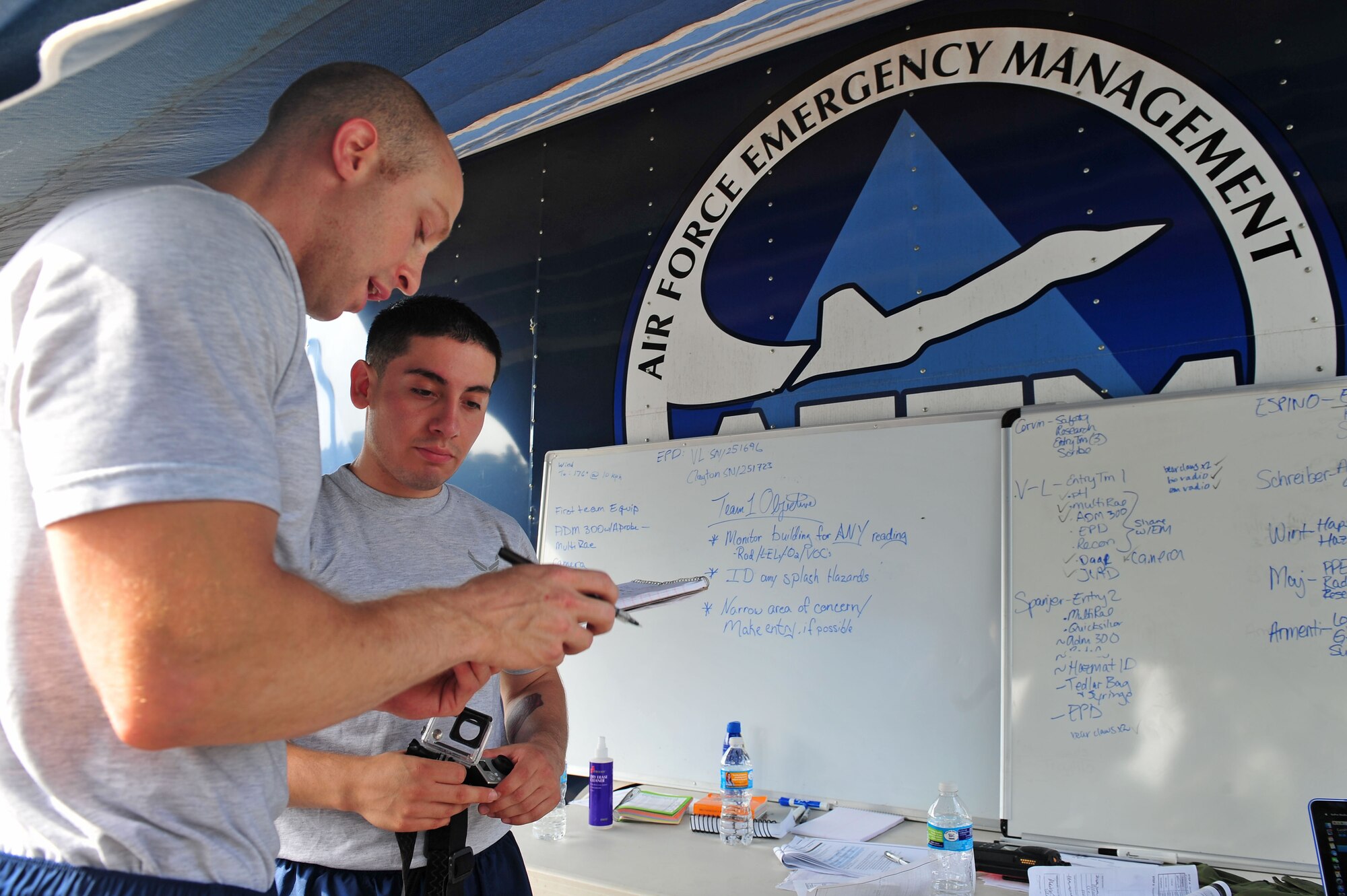 Senior Airmen James Corvin, left, and Elliseo Trujillo, 4th Aerospace Medicine Squadron bioenvironmental engineers, perform a health risk assessment during an integrated base emergency response capabilities training exercise, June 24, 2015, at Seymour Johnson Air Force Base, North Carolina. An HRA provides individuals with an evaluation of their health risks such as blood pressure, heart rate and overall health. (U.S. Air Force photo/Senior Airman John Nieves Camacho)