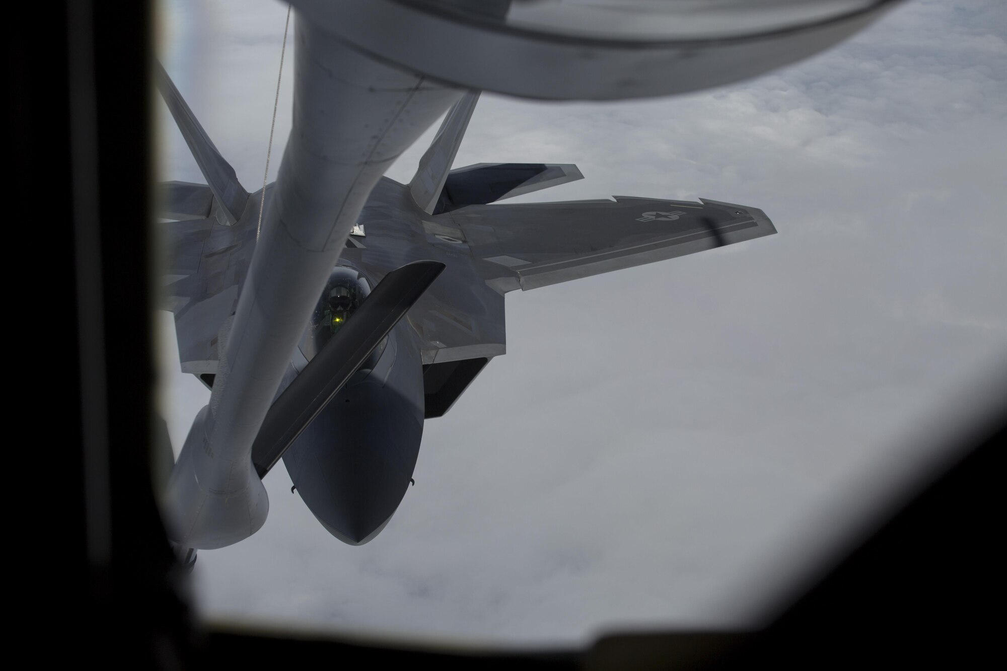 EIELSON AIR FORCE BASE, ALASKA – An F-22 Raptor prepares to refuel from a KC-135 Stratotanker from the 909th Air Refueling Squadron during Exercise Northern Edge, June 25, 2015. Northern Edge 2015 is Alaska’s premier joint training exercise designed to practice operations, tactics, techniques and procedures as well as enhance interoperability among the services. Thousands of Airmen, Soldiers, Sailors, Marines and Coast Guardsmen from active duty, Reserve and National Guard units, including tankers from the 18th Air Refueling Wing out of Kadena Air Force Base, Okinawa, Japan, are involved. (U.S. Marine Corps photo by Cpl. Thor J. Larson/Released)