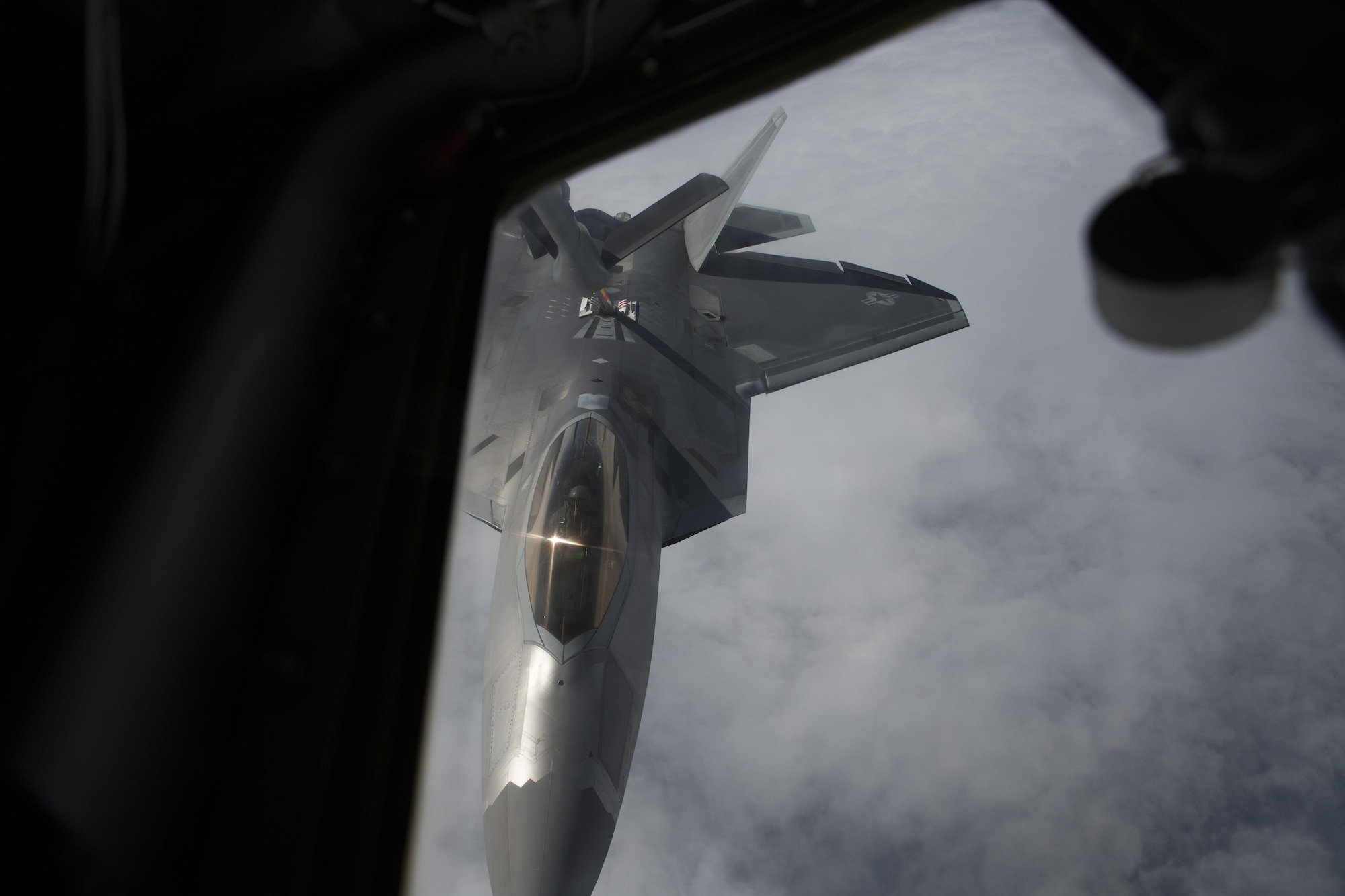 EIELSON AIR FORCE BASE, ALASKA – An F-22 Raptor refuels from a KC-135 Stratotanker from the 909th Air Refueling Squadron during Exercise Northern Edge, June 25, 2015. Northern Edge 2015 is Alaska’s premier joint training exercise designed to practice operations, tactics, techniques and procedures as well as enhance interoperability among the services. Thousands of Airmen, Soldiers, Sailors, Marines and Coast Guardsmen from active duty, reserve and National Guard units, including tankers from the 18th Air Refueling Wing out of Kadena Air Force Base, Okinawa, Japan, are involved. (U.S. Marine Corps photo by Cpl. Thor J. Larson/Released)