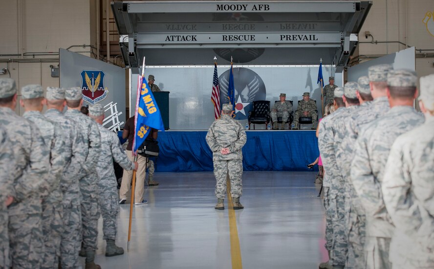 A formation led by U.S. Air Force Lt. Col. James Long, 23d Maintenance Group deputy commander, stand at ease during the 23d MXG change of command ceremony June 25, 2015, at Moody Air Force Base, Ga. The CoC ceremony is a military tradition that represents a formal transfer of authority from one commander to the other. (U.S. Air Force photo by Andrea Jenkins/Released)

