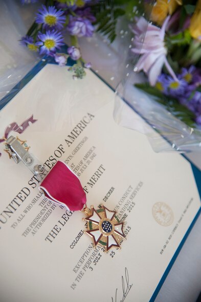 A Legion of Merit Medal rests on a table during the 23d Maintenance Group change of command ceremony June 25, 2015, at Moody Air Force Base, Ga. U.S. Air Force Col. Jeffrey Decker received the award for his outstanding service and leadership as commander of the 23d MXG. (U.S. Air Force photo by Andrea Jenkins/Released) 
