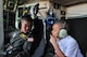 Honorary 2nd Lt. Trenton Bentley listens to his brother, Dillon, over the headset in the cockpit of a C-130 Hercules here, June 24, 2015. Trenton, who was diagnosed with acute lymphoblastic leukemia in December 2014, was nominated by Children’s Hospital of Pittsburgh to be the 911th Airlift Wing’s second ever Pilot for a Day. (U.S. Air Force photo by Staff Sgt. Allissa Landgraff)