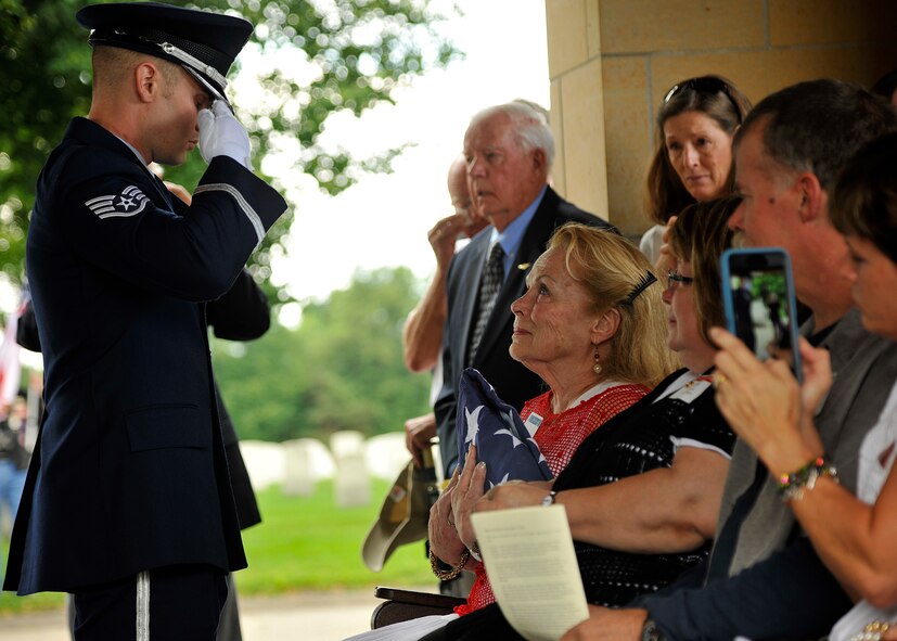 Staff Sgt. Robert Segler, 319th Air Base Wing Honor Guard ceremonial guardsman, gives the final salute to a flag presented to the widow of Maj. Robert Olson, U.S. Air Force veteran, on June 22, 2015 at Fort Snelling National Cemetery, Minn. Following DNA identification, Olson’s remains finally came home after 47 years to his wife and five children. (U.S. Air Force photo by Senior Airman Xavier Navarro/released) 