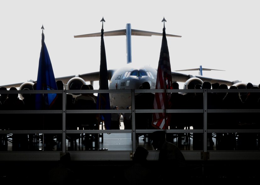 ALTUS AIR FORCE BASE, Okla. – A U.S. Air Force C-17 Globemaster III cargo aircraft sits on the flightline during the 97th Air Mobility Wing Change of Command Ceremony at Hangar 517, June 26. U.S. Air Force Col. Bill Spangenthal relinquished his command of the 97th AMW to U.S. Air Force Col. Todd Hohn. (U.S. Air Force photo by Airman 1st Class Megan E. Acs/Released)