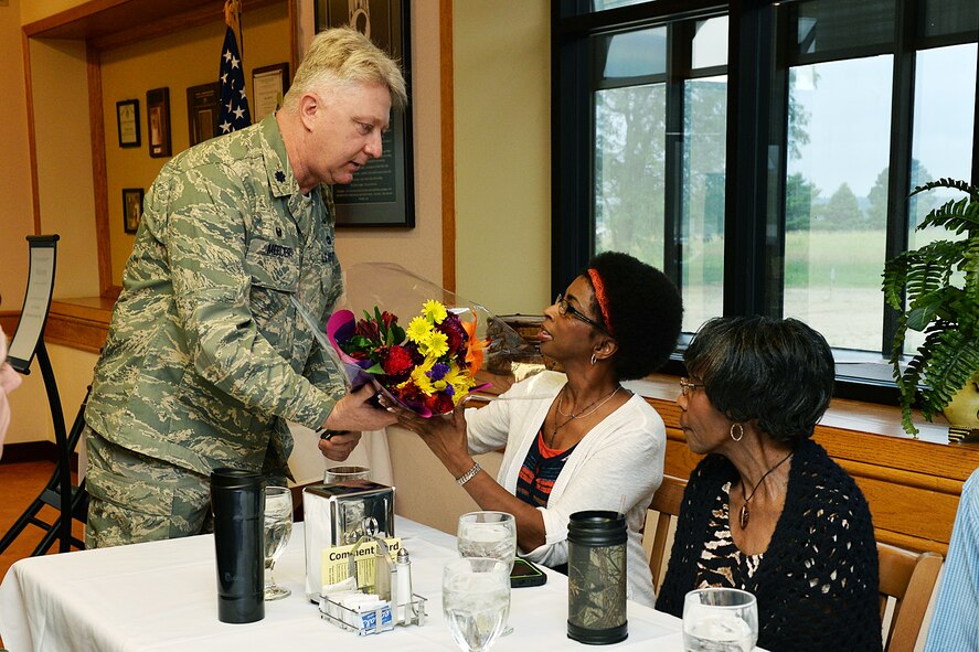 U.S. Air Force Lt. Col. Larry Mercier presents Yvette King, Staff Sgt. Ronald L. King’s widow, a bouquet of flowers during a special memorial breakfast honoring her late husband at Offutt Air Force Base, Nebraska, June 25. King lost his life along with 18 others in the Khobar Towers attack on June 25, 1996, while serving his country in Dhahran, Saudi Arabia. (U.S. Air Force photo by Charles Haymond/Released)