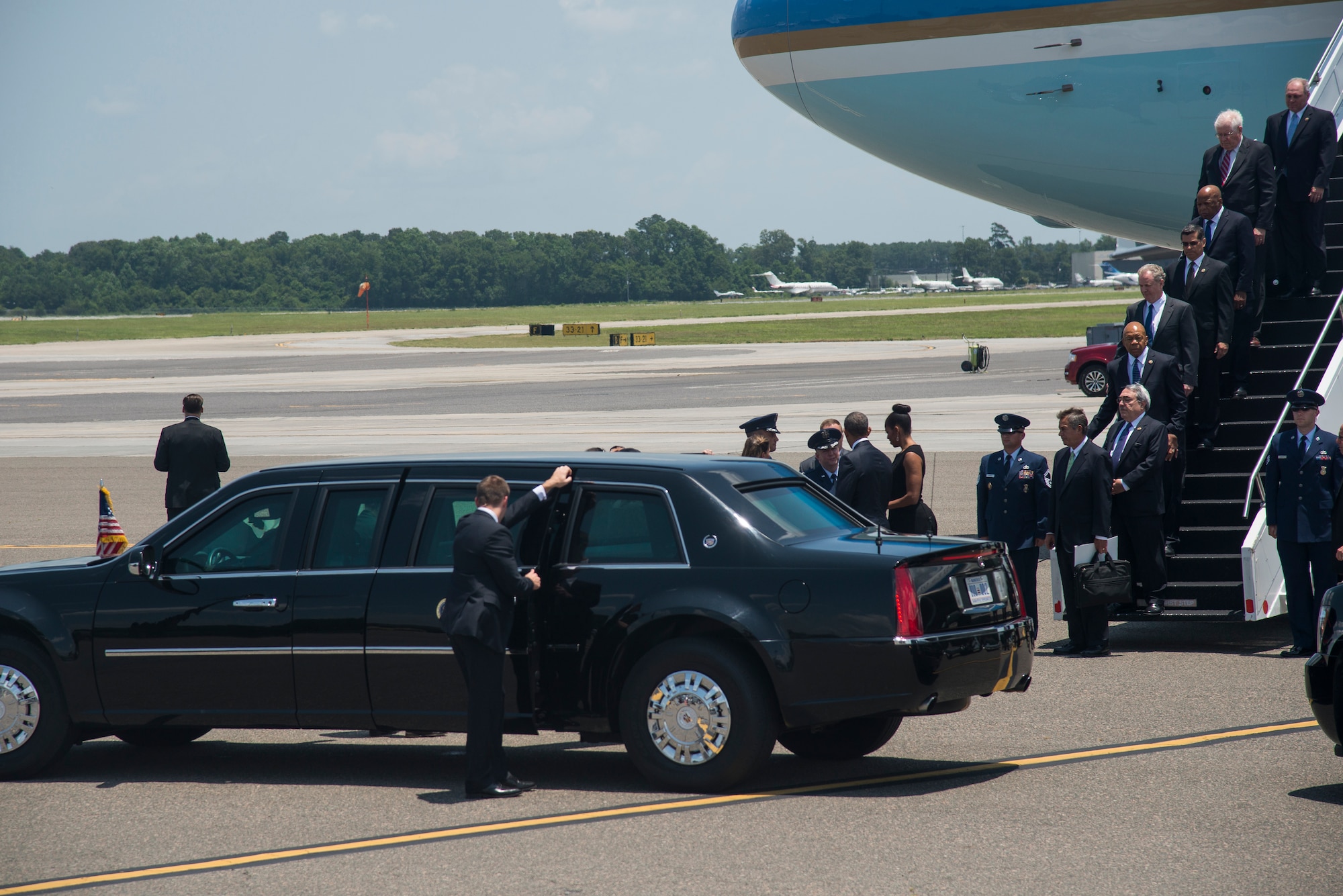 President Barack Obama and First Lady Michelle Obama greet Col. Jeffrey DeVore, Joint Base Charleston commander, and Col. John Lamontagne, 437th Airlift Wing commander and his wife Becky, June 26, 2015 at JB Charleston, S.C. The President and First Lady attended the funeral services of Rev. Clementa Pinckney at the College of Charleston TD Arena, where President Obama delivered the eulogy. Vice President Joe Biden and Dr. Jill Biden also attended. Reverend Pinckney was one of nine people fatally shot June 17, 2015 week during a Bible study at Emanuel AME Church in Downtown Charleston.(U.S. Air Force photo/Senior Airman George Goslin)