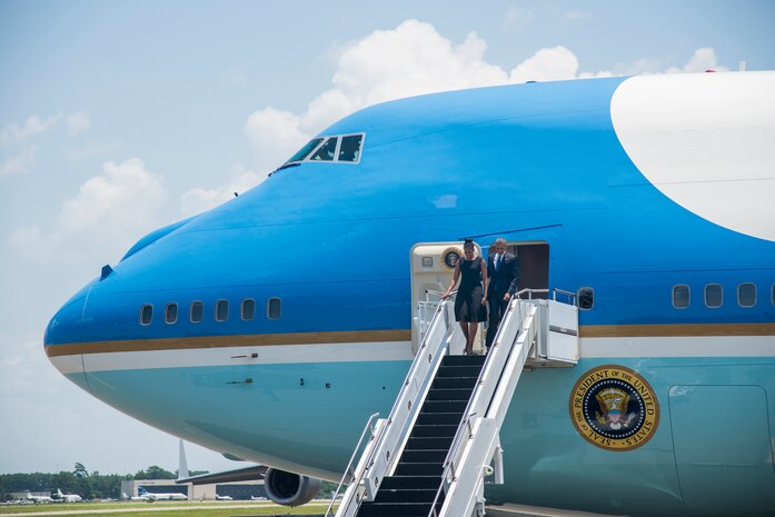 President Barack Obama arrives with First Lady Michelle Obama on the flightline June 26, 2015 at Joint Base Charleston, S.C. The President and First Lady attended the funeral services of Rev. Clementa Pinckney at the College of Charleston TD Arena, where President Obama delivered the eulogy. Vice President Joe Biden and Dr. Jill Biden also attended. Reverend Pinckney was one of nine people fatally shot June 17, 2015 week during a Bible study at Emanuel AME Church in Downtown Charleston.(U.S. Air Force photo/Senior Airman George Goslin)