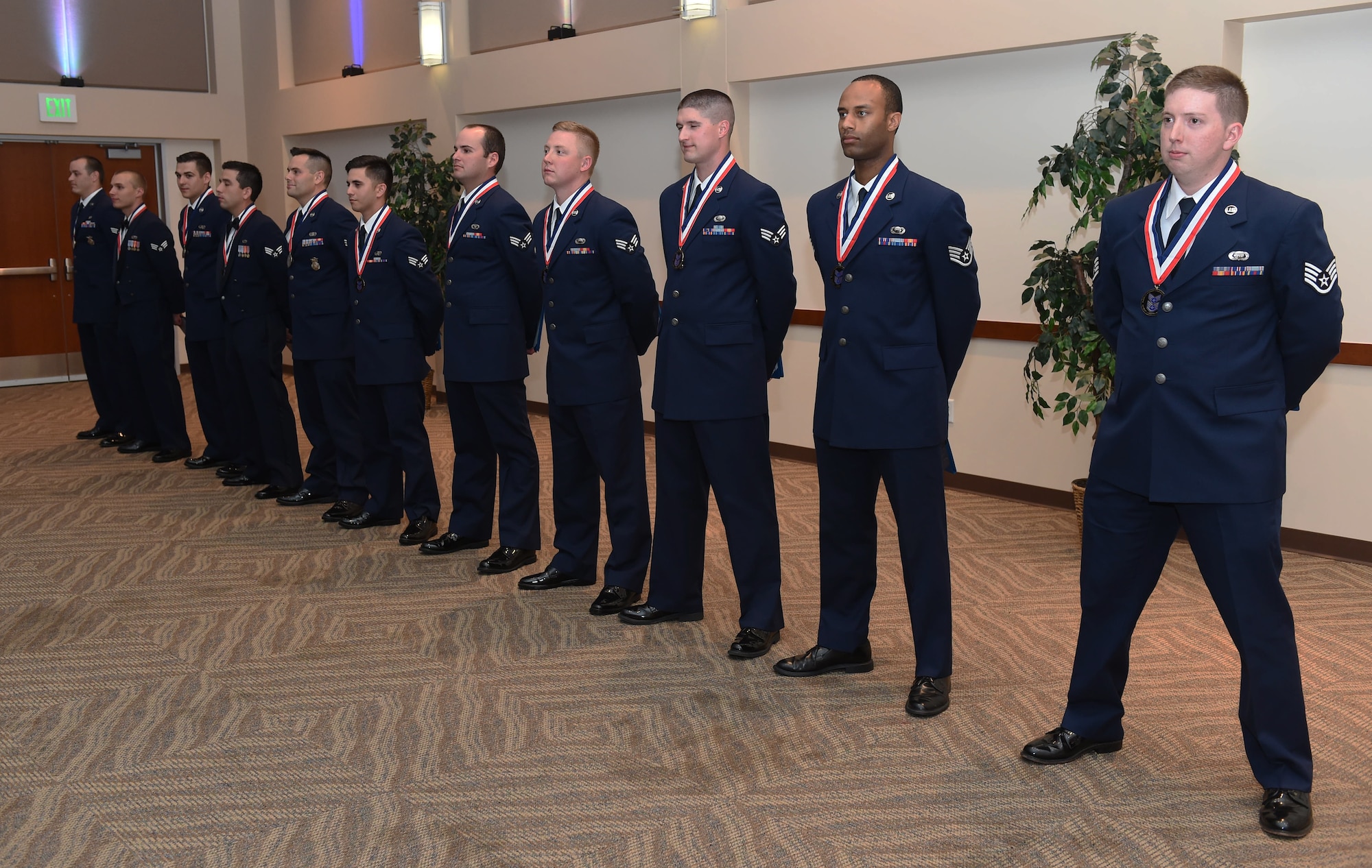 Buckley Airman Leadership School Class 15-E stand together after their graduation June 25, 2015, at the Leadership Development Center on Buckley Air Force Base, Colo. This graduation represents an important part of the enlisted force professional military education, teaching valuable skills required for supervisors. (U.S. Air Force photo by Airman 1st Class Samantha Meadors/Released)