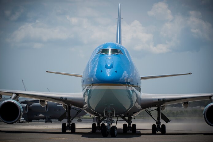 President Barack Obama arrives with First Lady Michelle Obama on the flightline June 26, 2015 at Joint Base Charleston, S.C. The President and First Lady attended the funeral services of Rev. Clementa Pinckney at the College of Charleston TD Arena, where President Obama delivered the eulogy. Vice President Joe Biden and Dr. Jill Biden also attended. Reverend Pinckney was one of nine people fatally shot June 17, 2015 week during a Bible study at Emanuel AME Church in Downtown Charleston. (U.S. Air Force photo/Senior Airman Jared Trimarchi) 