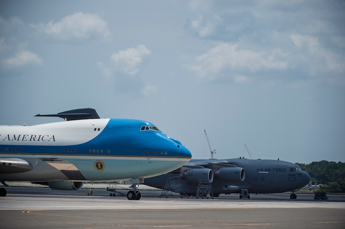 President Barack Obama arrives with First Lady Michelle Obama on the flightline June 26, 2015 at Joint Base Charleston, S.C. The President and First Lady attended the funeral services of Rev. Clementa Pinckney at the College of Charleston TD Arena, where President Obama delivered the eulogy. Vice President Joe Biden and Dr. Jill Biden also attended. Reverend Pinckney was one of nine people fatally shot June 17, 2015 week during a Bible study at Emanuel AME Church in Downtown Charleston. (U.S. Air Force photo/Senior Airman Jared Trimarchi) 