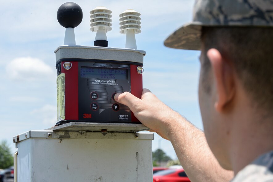 U.S. Air Force Senior Airman Andrew Keener, 23d Medical Group bioenvironmental engineering flight technician, checks the temperature on the wet bulb globe temperature machine June 25, 2015, at Moody Air Force Base, Ga. The WBGT also gives bioenvironmental technicians the current humidity and heat index. (U.S. Air Force photo by Senior Airman Sandra Marrero/Released)
