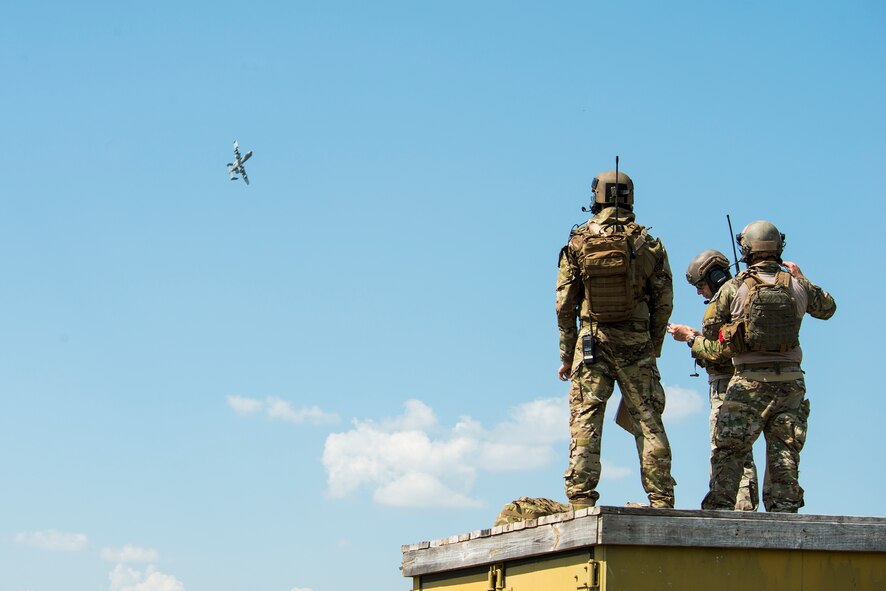 Airmen from the 7th Air Support Operations Squadron watch as an A-10C Thunderbolt II maneuvers during a joint training with the 74th Fighter Squadron June 18, 2015, on Grand Bay Bombing and Gunnery Range at Moody Air Force Base, Ga. During the two-week training, Airmen from the 7th ASOS utilized the A-10 simulator to allow them to see and understand an A-10 pilot’s responsibility. (U.S. Air Force photo by Airman 1st Class Ceaira Tinsley/Released)