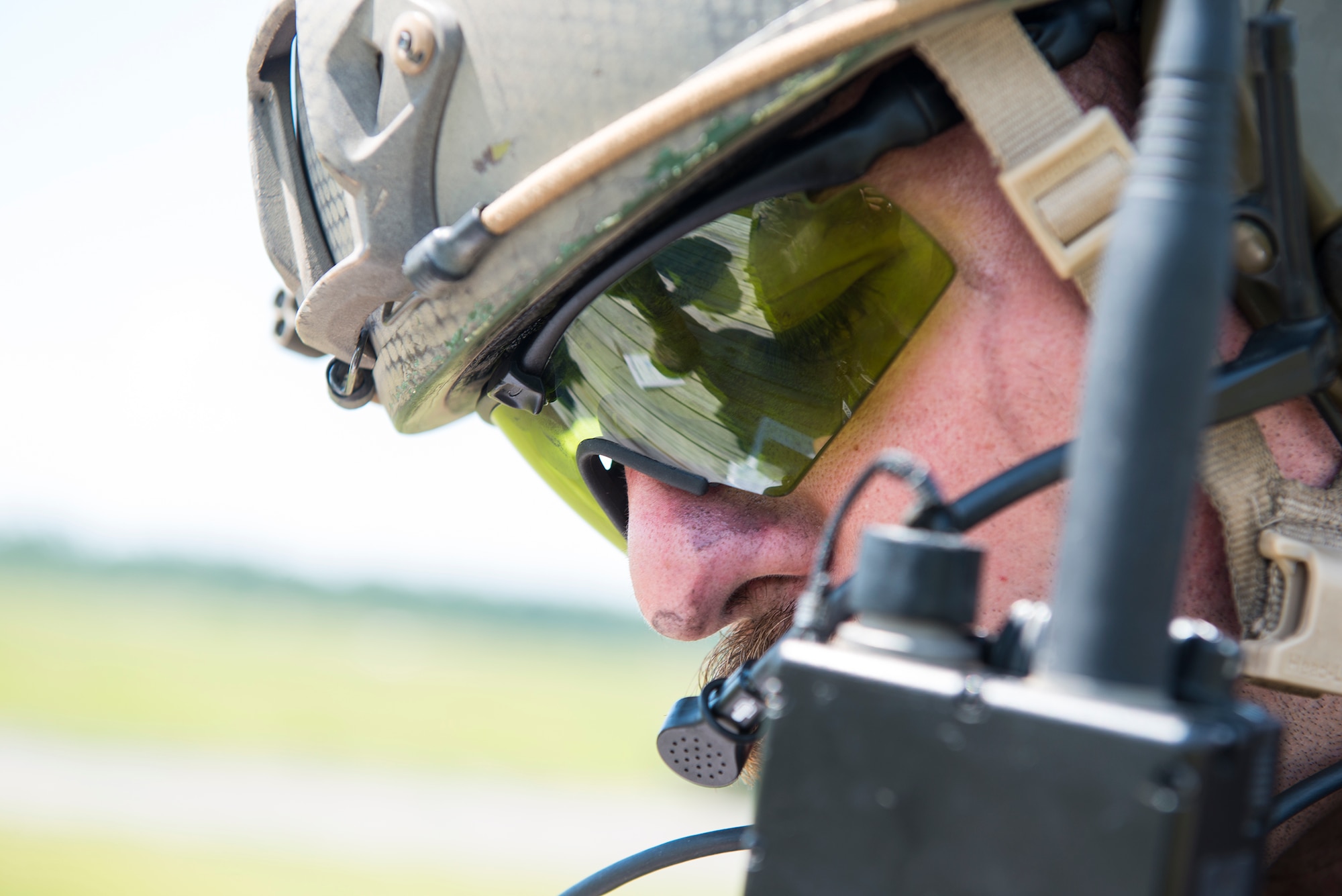 U.S. Air Force Staff Sgt. Tyler Puterbaugh, 7th Air Support Operations Squadron tactical air control party, calls in an A-10C Thunderbolt II strafe run during a joint training with the 74th Fighter Squadron June 18, 2015, on Grand Bay Bombing and Gunnery Range at Moody Air Force Base, Ga. The 74th FS and the 7th ASOS conducted a two-week joint training to maximize their training and improve their efficiency. (U.S. Air Force photo by Airman 1st Class Ceaira Tinsley/Released)