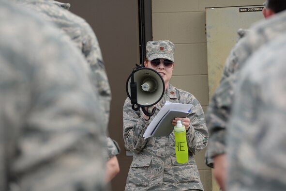 U.S. Air Force major with the 181st Intelligence Wing, addresses members of the 181st IW during evening formation at Camp Atterbury, Ind., June 7, 2015 during annual training. (U.S. Air National Guard photo by Airman 1st Class Lonnie Wiram)