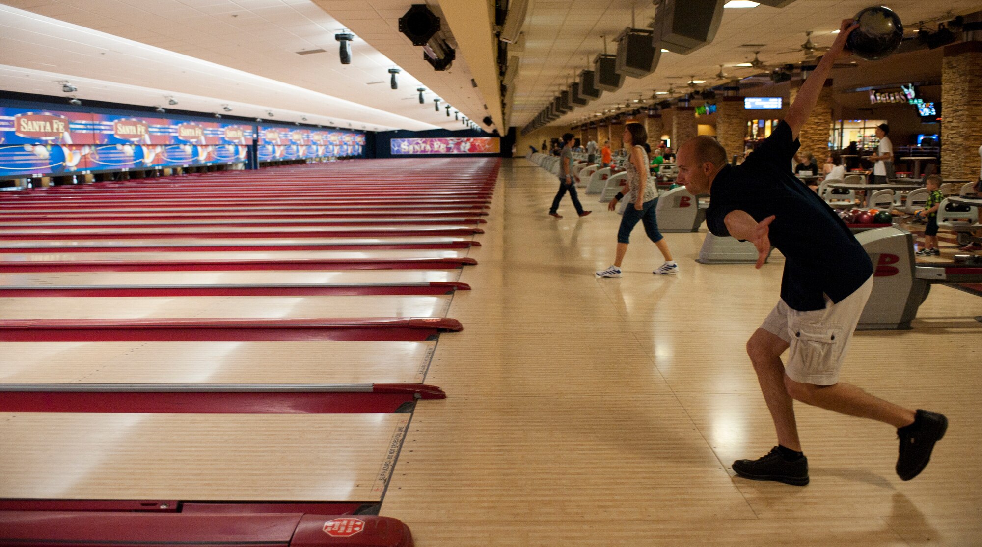 Staf f Sgt . Joshua Cramer, 57th Maintenance Squadron munitions systems technician, prepares to throw a bowling ball down a lane in Las Vegas, June 20, 2015. Cramer took fourth place in the Armed Forces Championships in May 2015 and is one of four bowlers on the U.S. Air Force Bowling Team. (U.S. Air Force photo by Airman 1st Class Mikaley Towle)