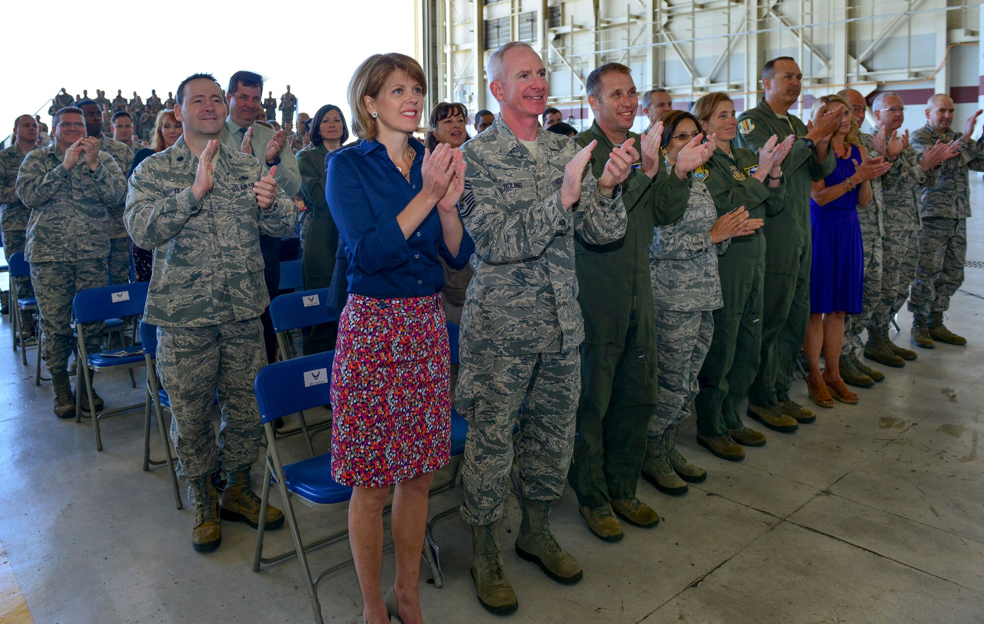 Colonel Joel Jackson, 60th Air Mobility Wing, commander, passes the quidon to Colonel Earl S. Scott who took control of the 60th Maintenance Group during his assumption of command ceremony held at hanger P-14, Travis AFB, June 22, 2015.  Jackson, who officiated the ceremony,  voiced his confidence in the new commander, lauding his previous accomplishments  (U.S. Air Force Photograph by Heide Couch/Released)