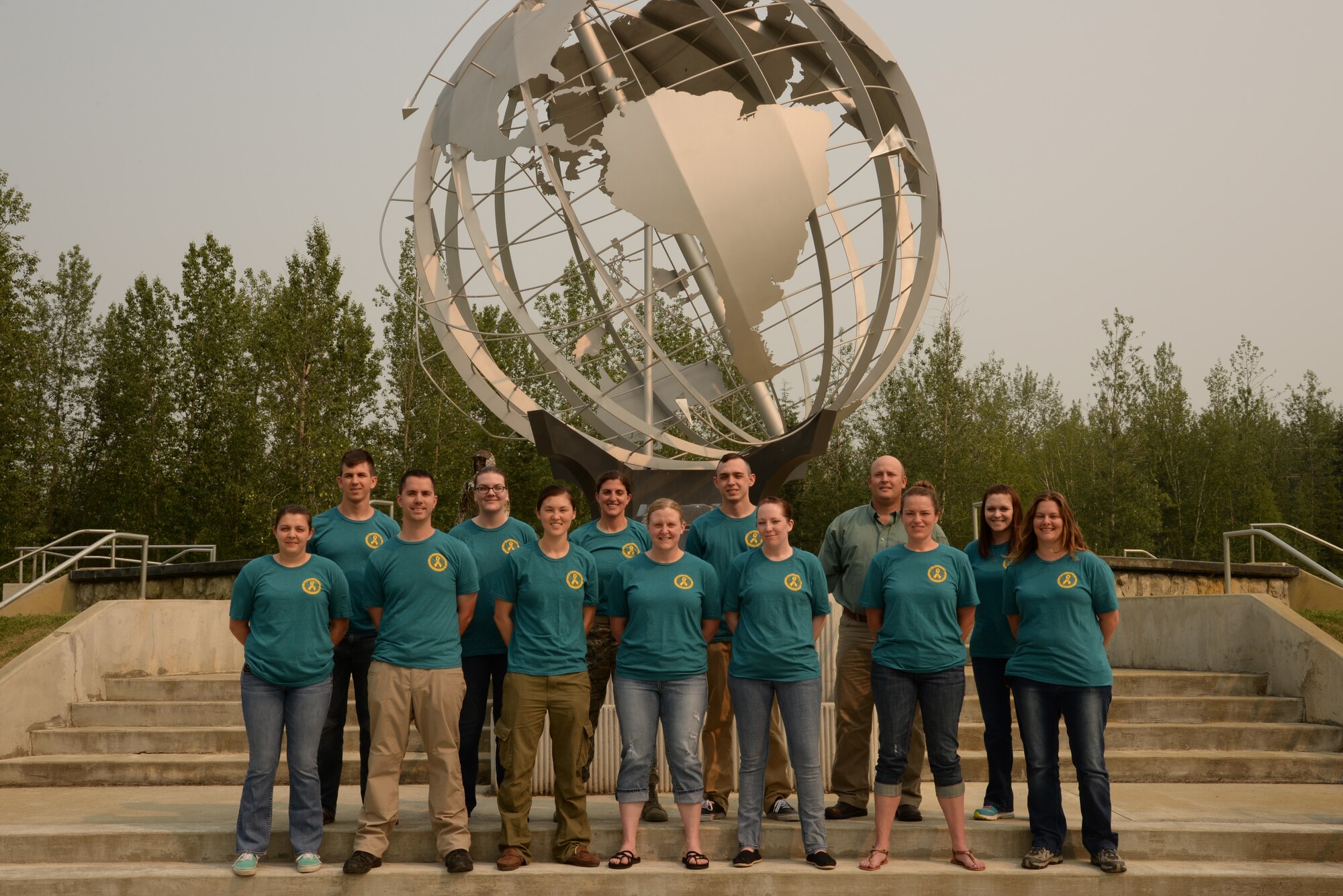 Victim Advocates assigned to the 354th Fighter Wing pose for a group photo June 25, 2015, at Eielson Air Force Base, Alaska. The Eielson Sexual Assault Prevention and Response office is supported by 17 victim advocates across the base. (U.S. Air Force photo by Staff Sgt. Kirsten Wicker/Released)