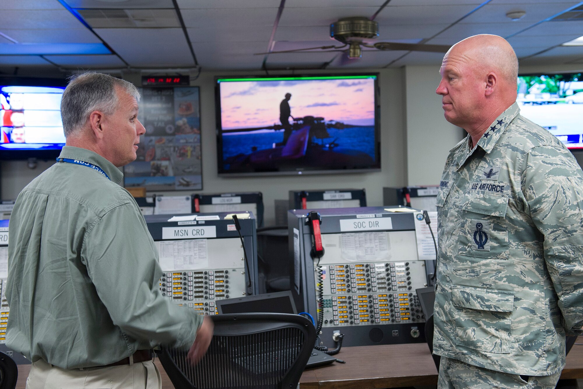 Lt. Gen. John Raymond, U.S. Strategic Command's Joint Functional Component Command for Space and 14th Air Force (Air Forces Strategic) commander, listens as Jay Summers, 45th Operations Group Detachment 3 communications specialist, gives him a tour of the Department of Defense Human Space Flight Support Operations Center, June 24, 2015, at Patrick Air Force Base, Fla. The SOC is where Detachment 3 conducts command, control, and communications during DOD support to U.S. Human Space Flight Missions. (U.S. Air Force photo/Matthew Jurgens) (Released)