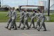 Senior Airman Amanda Wagemann, of the 119th Wing, right, leads a group of Airmen through the marching phase of drill testing of Airman Leadership School (ALS) at the North Dakota Air National Guard Base, Fargo, North Dakota, June 25, 2015. The ALS training prepares the Airmen for leadership roles within the Air National Guard. The five-week ALS course is being conducted by Tech. Sgt. James Richey, an instructor from the Chief Master Sgt. Richard L. Etchberger Airman Leadership School at the Grand Forks Air Force Base, North Dakota, who traveled to the Air National Guard base to be more cost effective. This is the first flight of Airman to be taught by Richey, in his two and a half years of instructing, to have all students in the flight pass the summative test, which covers all concepts taught during the course. (U.S. Air National Guard photo by SMSgt. David H. Lipp/Released)