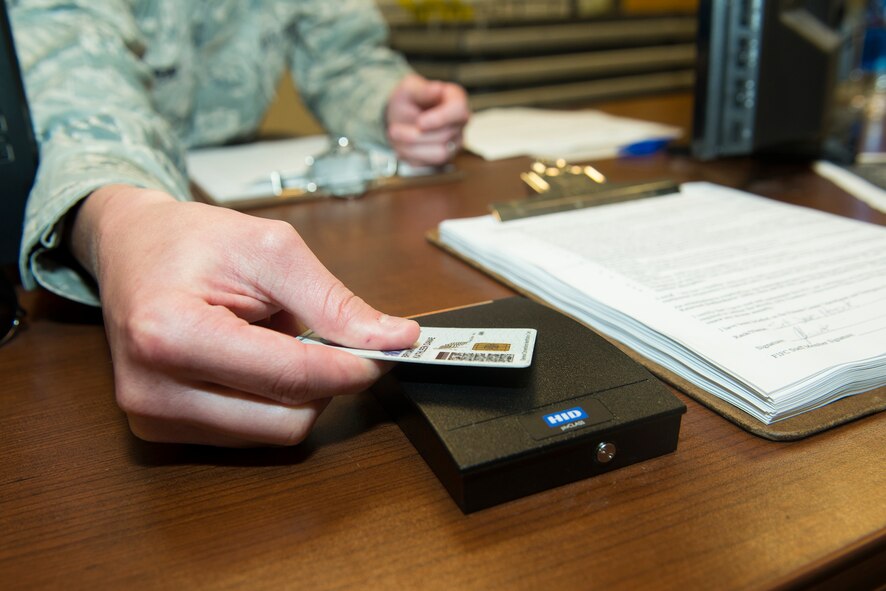 U.S. Air Force Senior Airman Matthew Jenkins, 23d Force Support Squadron fitness specialist, registers a Common Access Card in the Freedom 1 Fitness Center June 25, 2015, at Moody Air Force Base, Ga. Active-duty members will have 24-hour access to the gym starting July 1. (U.S. Air Force photo by Airman 1st Class Kathleen D. Bryant/Released)