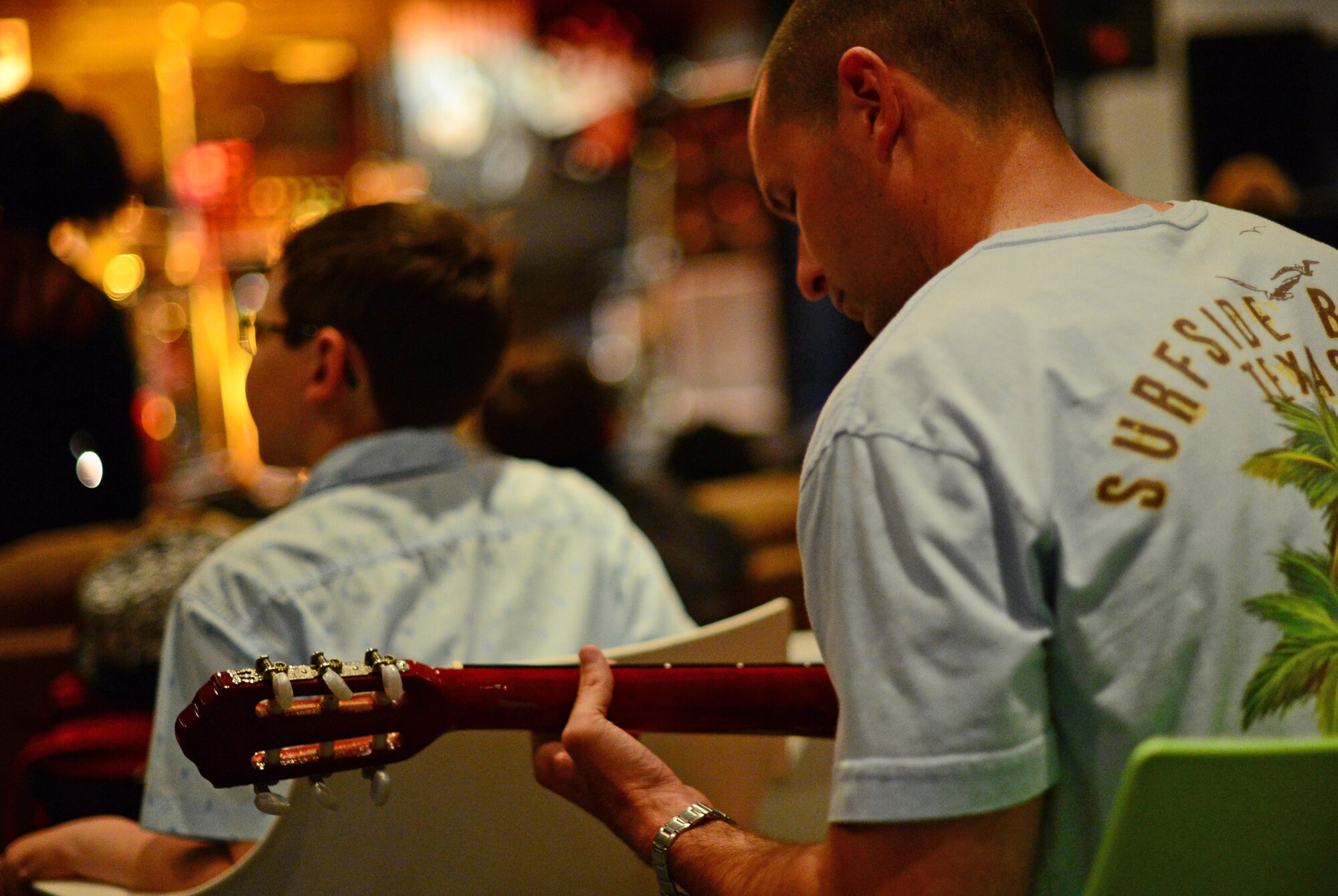 Tech. Sgt. Rickey Wiggington, 48th Medical Group pediatric clinic flight chief, plays guitar before the start of Electric Avenue’s Open Mic Jam Night at Royal Air Force Lakenheath, England, June 17, 2015. The event gives personnel from around base an opportunity to collaborate and network with other musicians. (U.S. Air Force photo by Senior Airman Erin O’Shea/Released)  