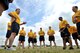 U.S. Navy Cryptologic Technician Collection Senior Chief Kristofor, U.S. Joint Intelligence Operations Center, Europe Analytic Center Senior Enlisted Leader, far left, briefs members of the Chief Petty Officer 365 group after a heritage run at RAF Molesworth, United Kingdom, June 19, 2015. The run combined physical training, classroom training and heritage into one event in the first phase of the three-phase CPO 265 program. (U.S. Air Force photo by Staff Sgt. Ashley Hawkins/Released) (Last names were removed for security purposes)