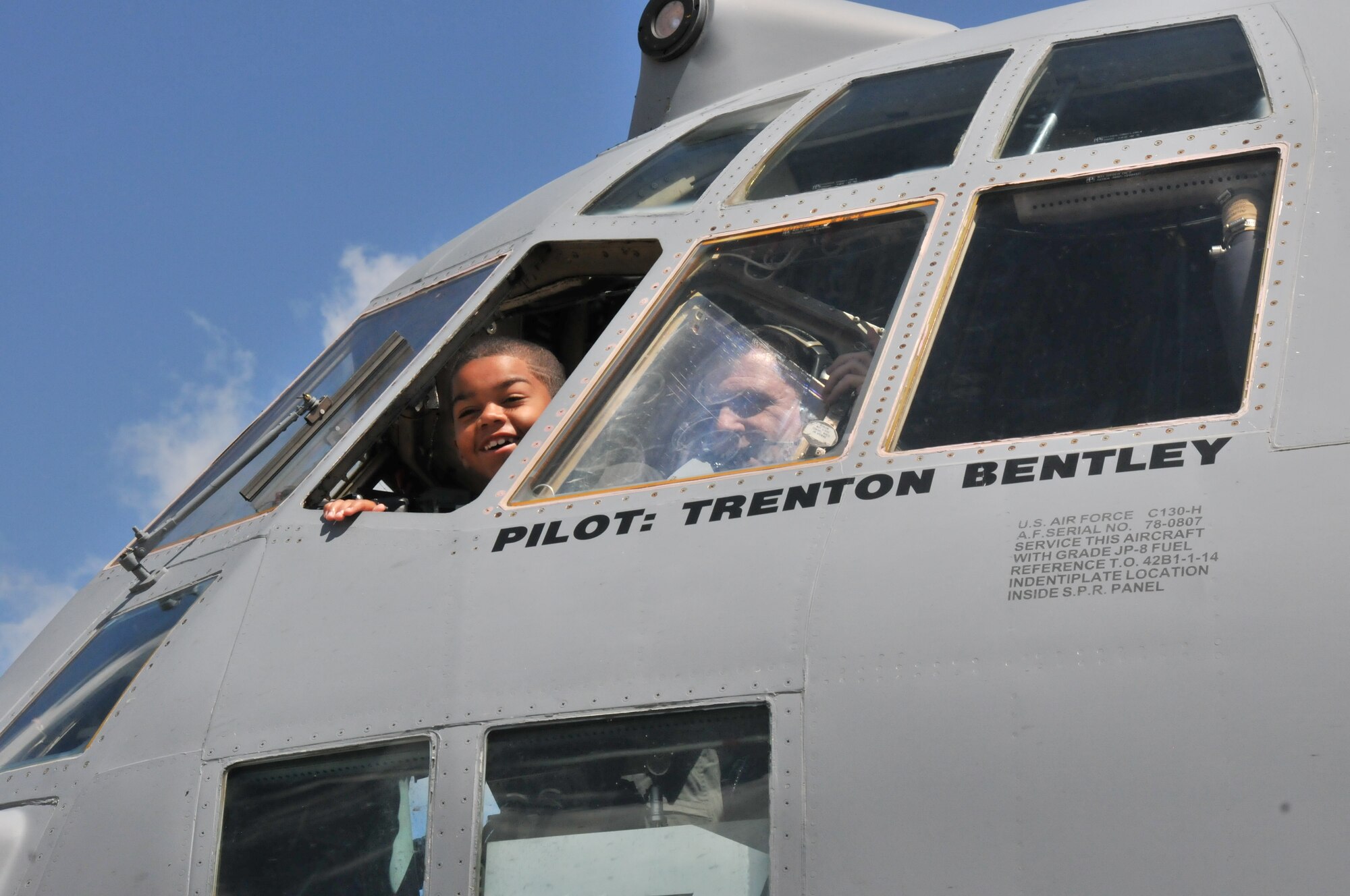 Honorary 2nd Lt. Trenton Bentley calls to family members out the window of a C-130 Hercules here, June 24, 2015. Trenton, who was diagnosed with acute lymphoblastic leukemia in December 2014, was nominated by Children’s Hospital of Pittsburgh to be the 911th Airlift Wing’s second ever Pilot for a Day. (U.S. Air Force photo by Staff Sgt. Allissa Landgraff)