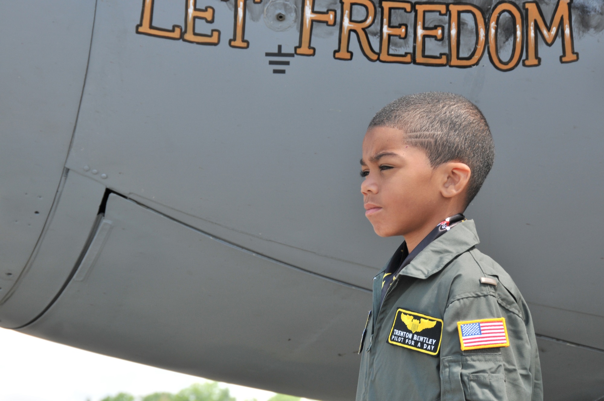 Honorary 2nd Lt. Trenton Bentley looks out at the flightline while standing next to a C-130 Hercules here, June 24, 2015. Trenton, who was diagnosed with acute lymphoblastic leukemia in December 2014, was nominated by Children’s Hospital of Pittsburgh to be the 911th Airlift Wing’s second ever Pilot for a Day. (U.S. Air Force photo by Senior Airman Marjorie A. Bowlden)