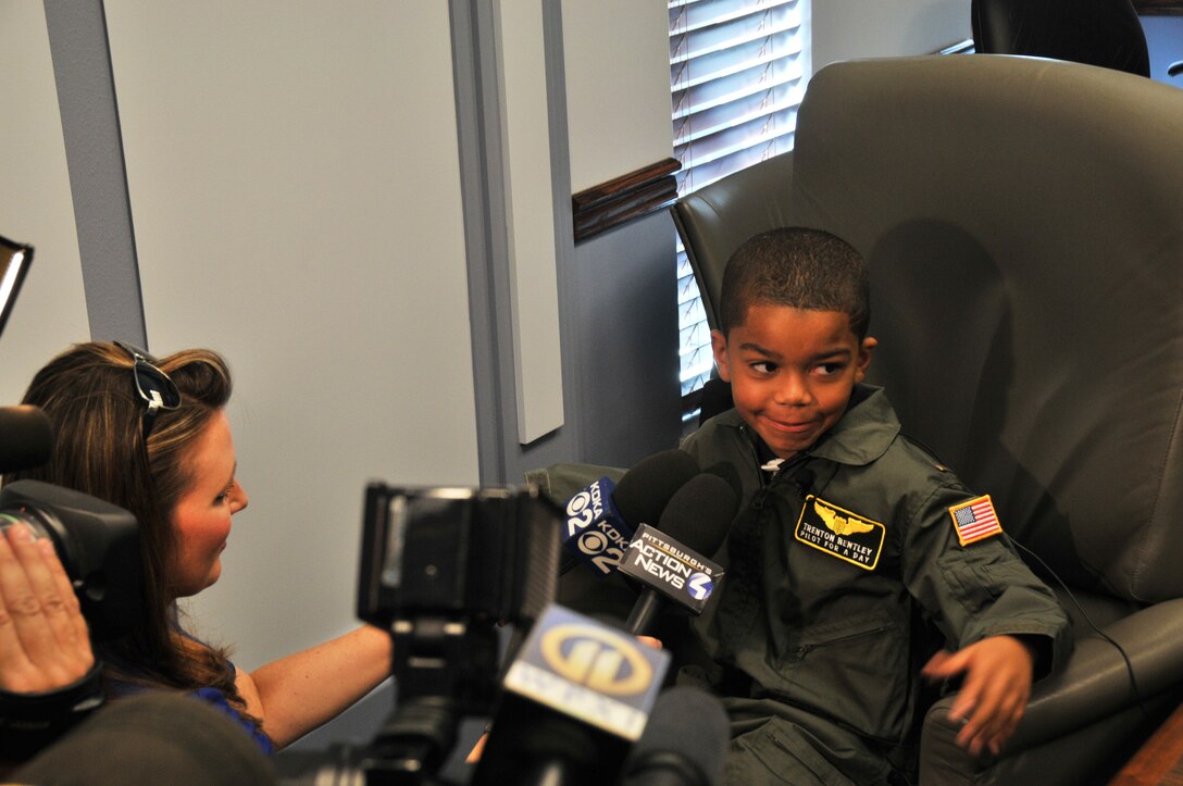 Honorary 2nd Lt. Trenton Bentley is interviewed by several members of the Pittsburgh area media here, June 24, 2015. Trenton, who was diagnosed with acute lymphoblastic leukemia in December 2014, was nominated by Children’s Hospital of Pittsburgh to be the 911th Airlift Wing’s second ever Pilot for a Day. (U.S. Air Force photo by Senior Airman Marjorie A. Bowlden)
