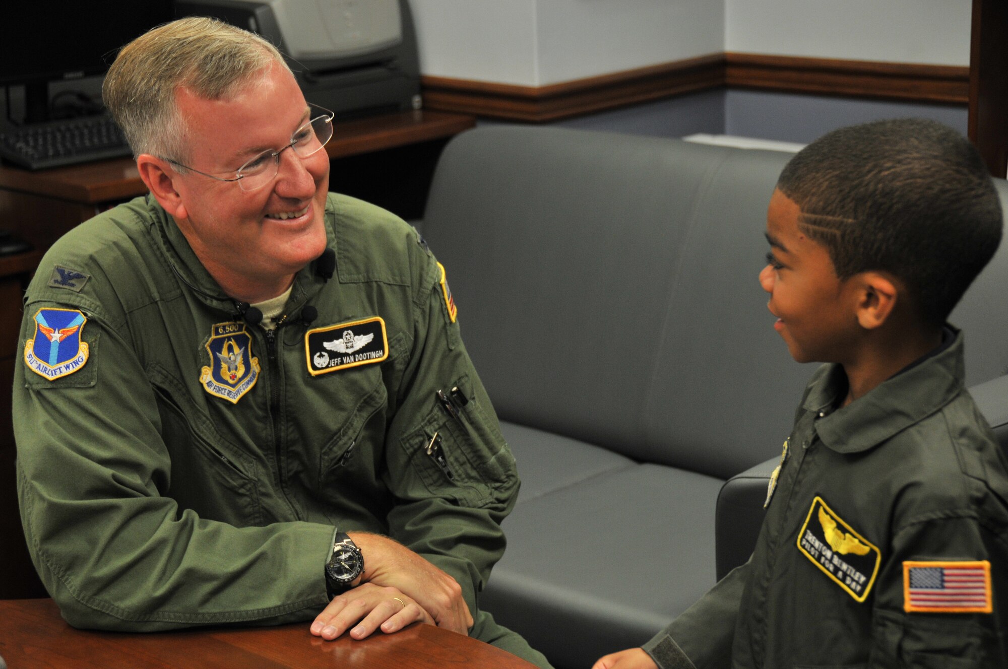Col. Jeffrey Van Dootingh, commander of the 911th Airlift Wing, discusses plans for the day with honorary 2nd Lt. Trenton Bentley here, June 24, 2015. Trenton, who was diagnosed with acute lymphoblastic leukemia in December 2014, was nominated by Children’s Hospital of Pittsburgh to be the 911th AW’s second ever Pilot for a Day. (U.S. Air Force photo by Senior Airman Marjorie A. Bowlden)