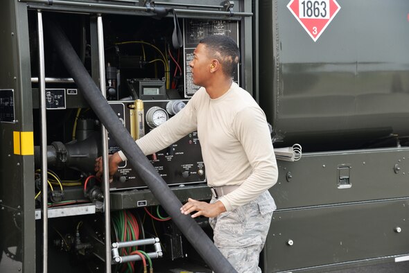 EIELSON AIR FORCE BASE, Alaska -- U.S. Air Force Airman 1st Class Anthony Jackson, a fuels management technician from the 18th Logistics Readiness Squadron, Kadena Air Base, Japan, turns the fuel pump off after re-fueling an F-15 Eagle June 23, 2015, at Eielson Air Force Base, Alaska. The fuel truck, an R-11, can hold approximately 6,000 gallons of fuel. Northern Edge 2015 is Alaska’s premier joint training exercise designed to practice operations, techniques and procedures as well as enhance interoperability among the services. Thousands of participants from all the services, Airmen, Soldiers, Sailors, Marines and Coast Guardsmen from active duty, Reserve and National Guard units are involved. (U.S. Air Force photo by Staff Sgt. Kirsten Wicker/Released)  