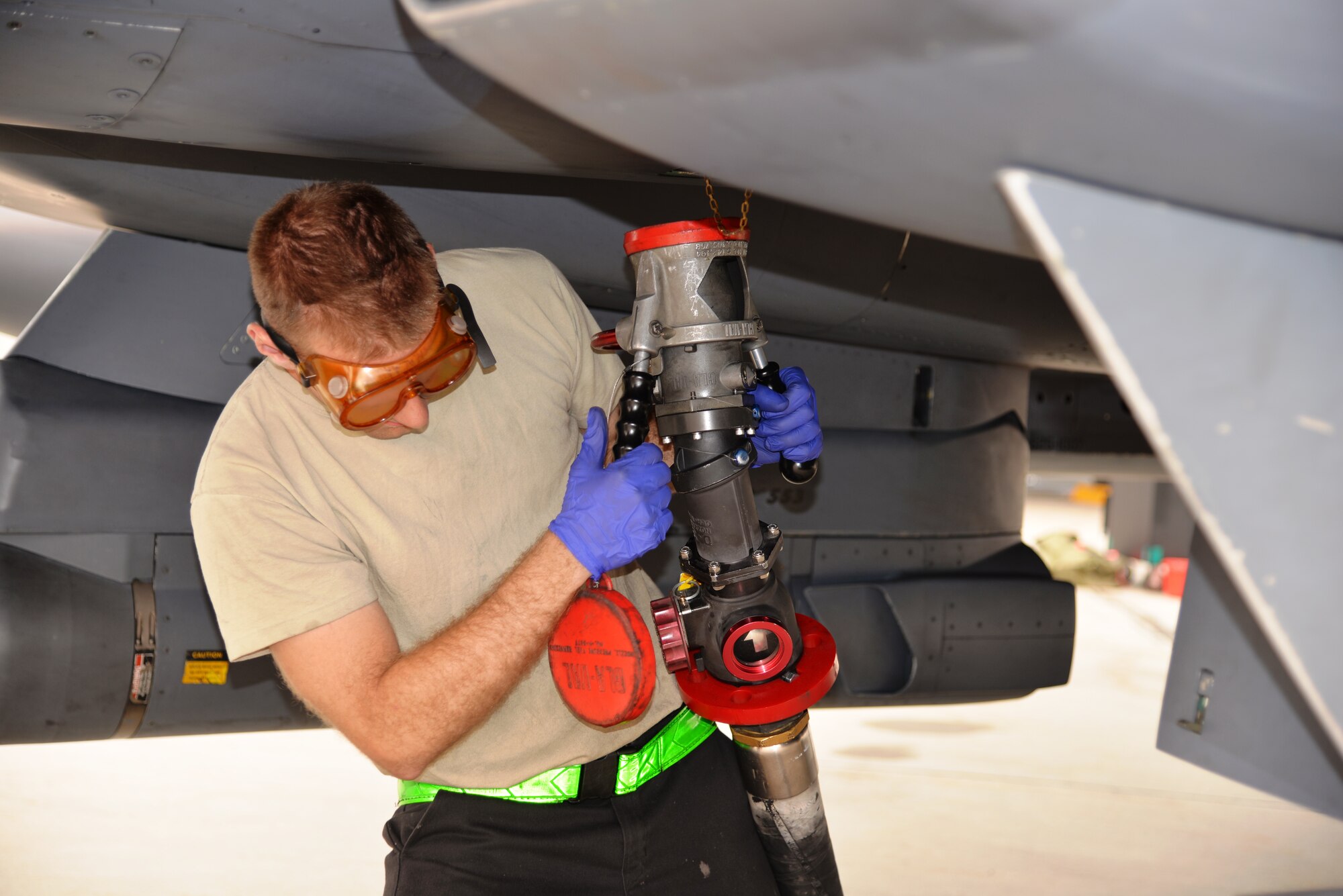EIELSON AIR FORCE BASE, Alaska -- U.S. Air Force crew chief from the 4th Fighter Wing, Seymour Johnson Air Force Base, N.C., detaches a fuel hose from an F-15 Eagle after re-fueling June 23, 2015, at Eielson Air Force Base, Alaska during Northern Edge 15. Northern Edge 2015 is Alaska’s premier joint training exercise designed to practice operations, techniques and procedures as well as enhance interoperability among the services. Thousands of participants from all the services, Airmen, Soldiers, Sailors, Marines and Coast Guardsmen from active duty, Reserve and National Guard units are involved. (U.S. Air Force photo by Staff Sgt. Kirsten Wicker/Released)