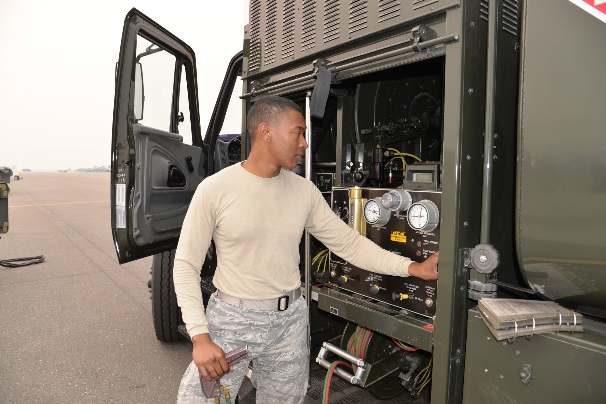 EIELSON AIR FORCE BASE, Alaska -- U.S. Air Force Airman 1st Class Anthony Jackson, a fuels management technician from the 18th Logistics Readiness Squadron, Kadena Air Base, Japan, prepares the fuel truck, an R-11 that holds approximately 6,000 gallons of fuel, to re-fuel an F-15 Eagle after a sortie June 23, 2015, at Eielson Air Force Base, Alaska. Northern Edge 2015 is Alaska’s premier joint training exercise designed to practice operations, techniques and procedures as well as enhance interoperability among the services. Thousands of participants from all the services, Airmen, Soldiers, Sailors, Marines and Coast Guardsmen from active duty, Reserve and National Guard units are involved. (U.S. Air Force photo by Staff Sgt. Kirsten Wicker/Released)  