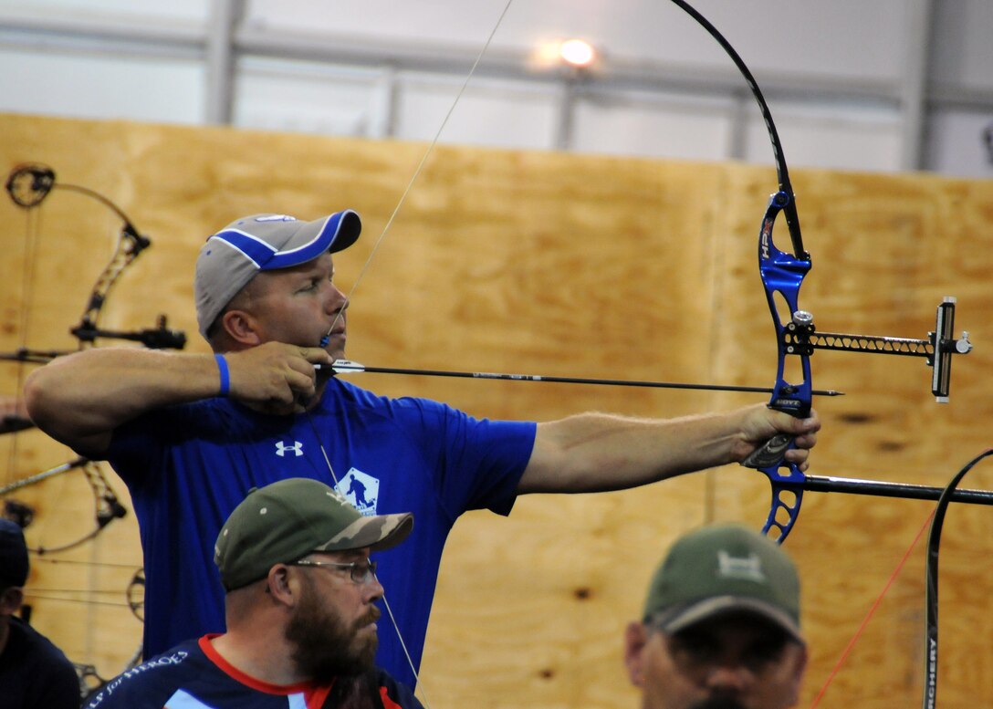 Retired Air Force Master Sgt. Craig Zaleski aims a recurve bow during the archery competition at the 2015 DoD Warrior Games at Marine Corps Base Quantico, Va., June 22, 2015. DoD photo by Shannon Collins