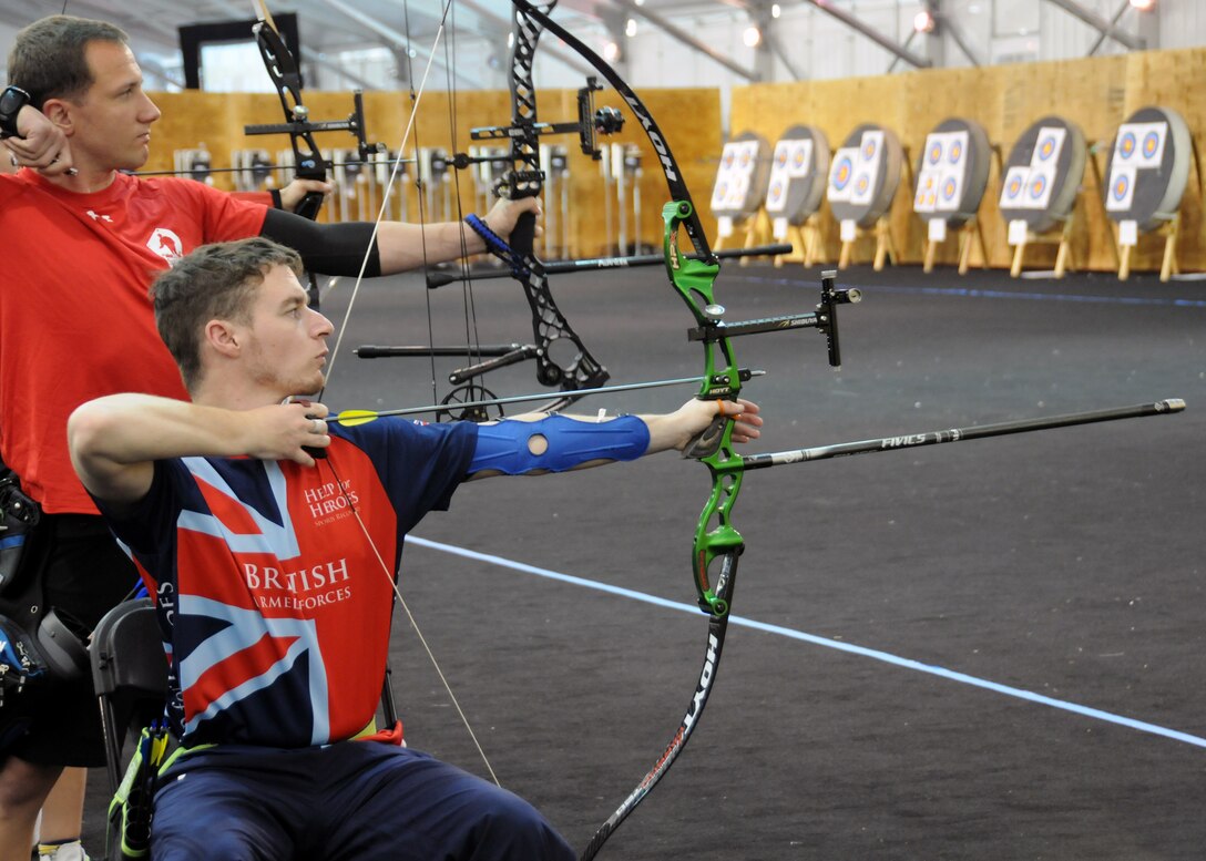 British army Gunner Declan O'Halloran aims during the recurve archery competition at the 2015 DoD Warrior Games at Marine Corps Base Quantico, Va., June 22, 2015. O'Halloran and the British Forces team earned a bronze in team recurve archery. DoD photo by Shannon Collins