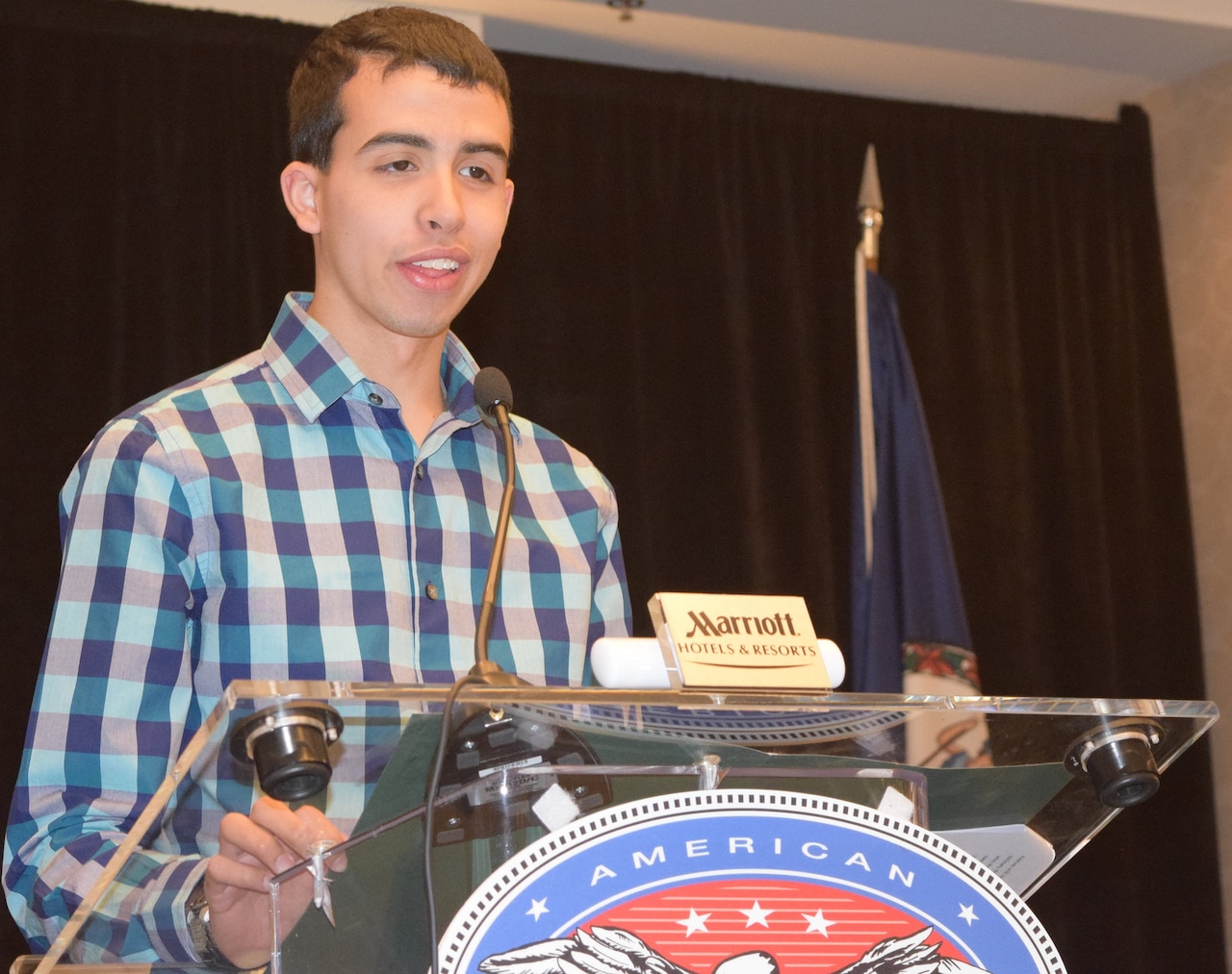 Scholarship for Military Children recipient Adrian Martinez, a home-school student from Fort Lee, Va., speaks at the scholarship luncheon during the Commissary Roundtable in Richmond, Va., April 30, 2015. DoD photo by Kevin Robinson