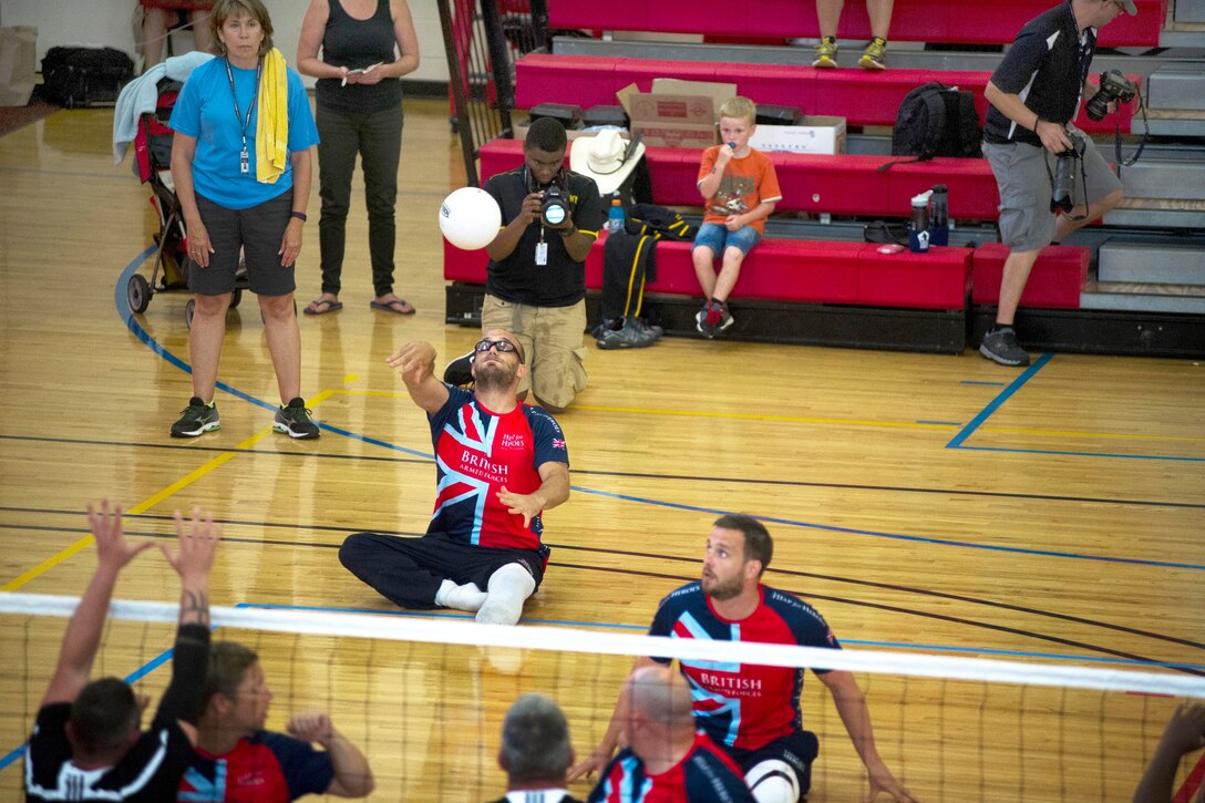 U.S. Team Army competes against the British forces team in a sitting volleyball match during the 2015 Department of Defense Warrior Games on Marine Corps Base Quantico, Va., June 25, 2015. The games are an adaptive sports competition for wounded, ill and injured service members and veterans. Approximately 250 athletes, representing teams from the U.S. Army, Marine Corps, Navy, Air Force, Special Operations Command and British forces are competing in archery, cycling, track and field, shooting, sitting volleyball, swimming and wheelchair basketball. 