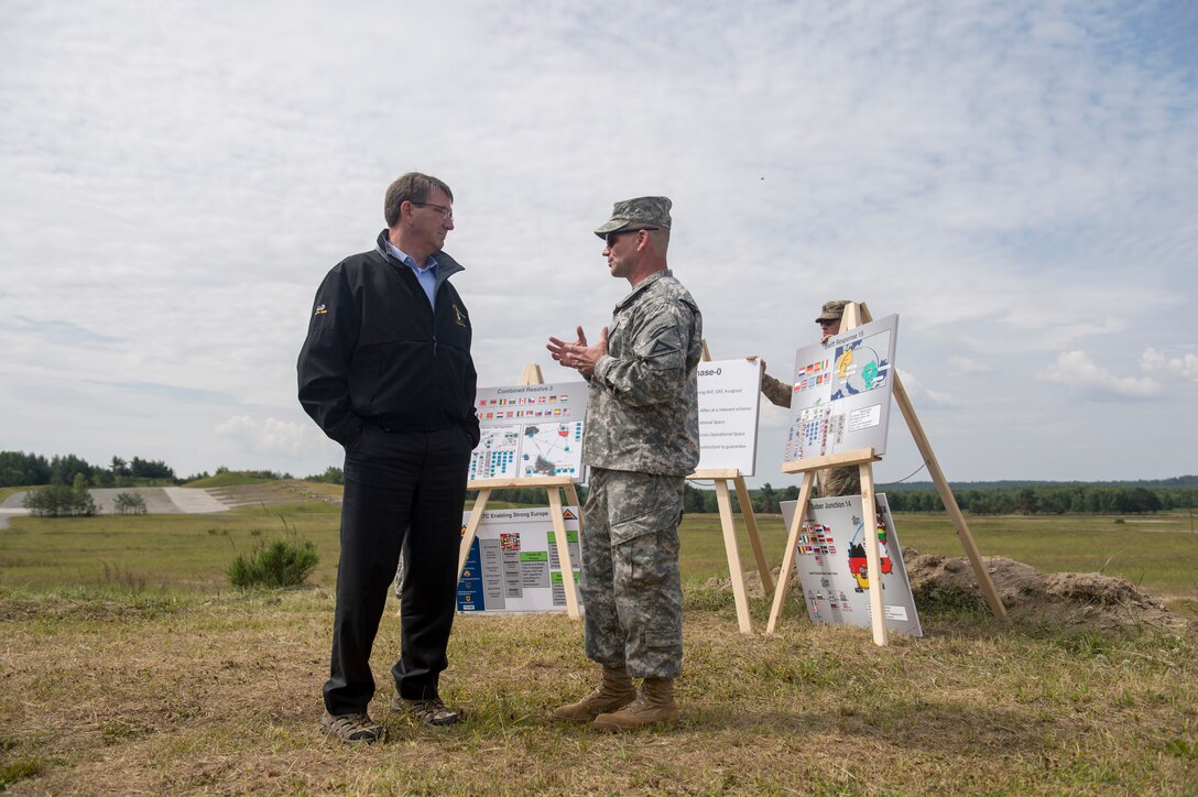 U.S. Defense Secretary Ash Carter asks a question as he receives a briefing from U.S. Army Brig. Gen. Christopher Cavoli, commanding general of the Joint Multinational Training Command, at the Grafenwoehr Training Area in Grafenwoehr, Germany, June 26, 2015.