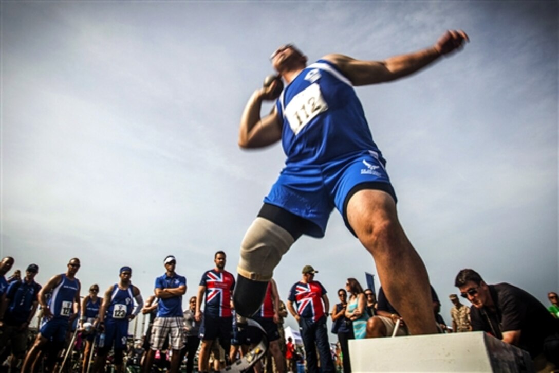 Air Force Tech. Sgt. Jason Caswell throws the shot put during field competition for the 2015 DOD Warrior Games on Marine Corps Base Quantico, Va., June 23, 2015.  