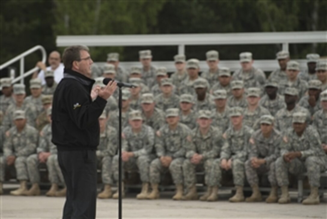 U.S. Defense Secretary Ash Carter speaks to a group of U.S., U.K., Romanian and German soldiers at the Grafenwoehr Training Area in Grafenwoehr, Germany, June 26, 2015. The troop visit was the last leg of a trip to Europe, where Carter attended his first ministerial in Brussels as defense secretary.