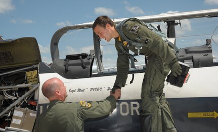 Col. David Drichta (left), 12th Operations Group commander and former T-37 Tweet first assignment instructor pilot, welcomes an attendee to the “FAIP-a-Palooza” conference June 26, 2015 at Joint Base San Antonio-Randolph, Texas.  The conference was hosted by the 12th Flying Training Wing to provide first assignment instructor pilots (FAIP) across Air Education and Training Command officer professional development information and stimulate cross-talk amongst FAIPs. (U.S. Air Force photo/Joel Martinez)
