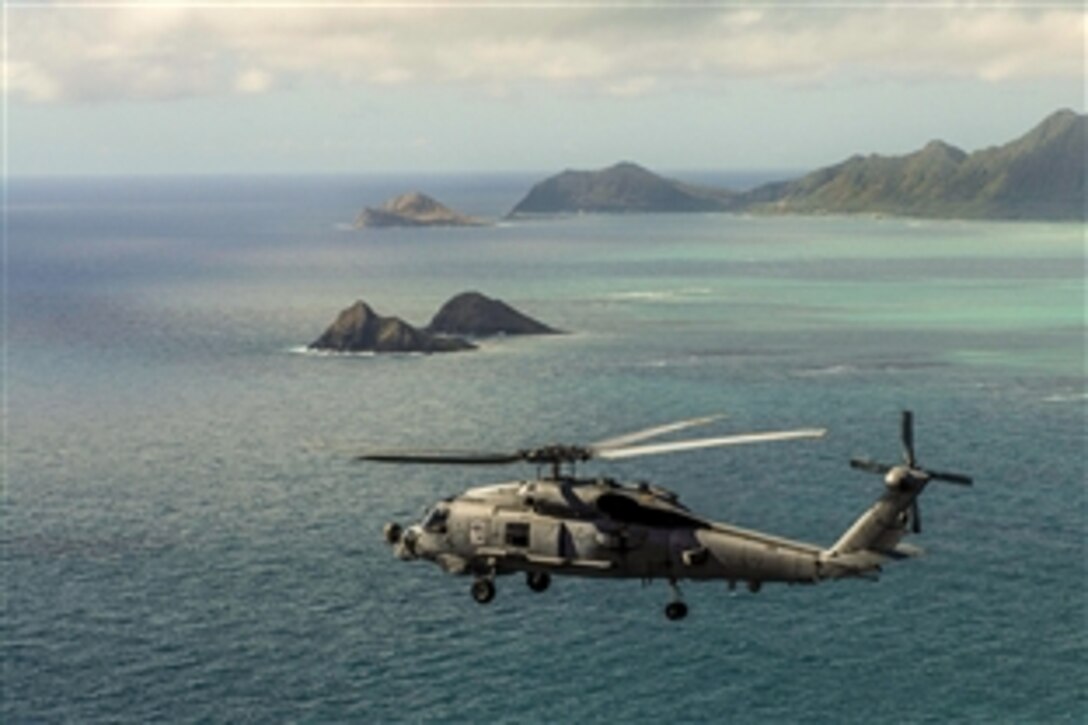 An MH-60R Seahawk helicopter conducts flight training operations over the island of Oahu, Hawaii, June 23, 2015. The Seahawk is assigned to Helicopter Maritime Strike Squadron 37. 