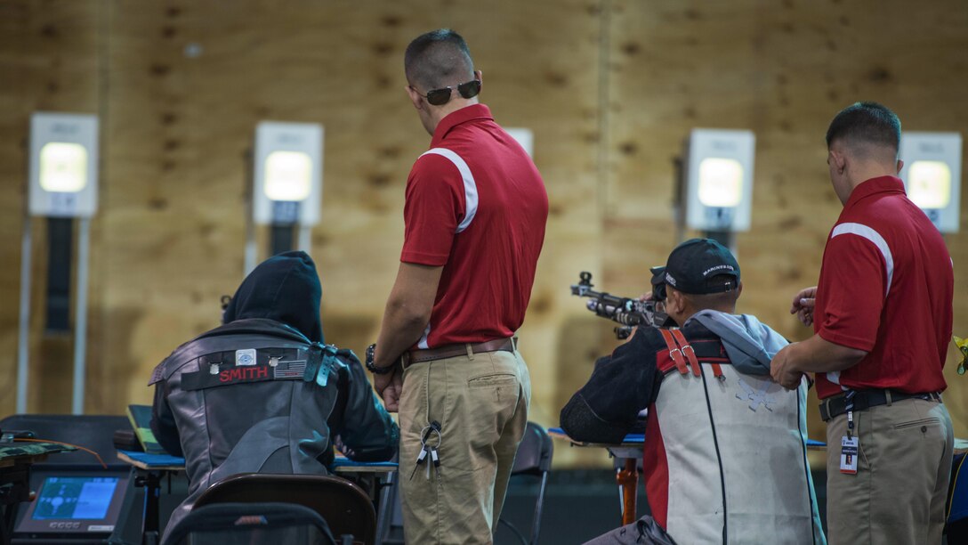 Members of the All-Marine Team sights down range during the 2015 Department of Defense (DoD) Warrior Games shooting competition at Marine Corps Base (MCB) Quantico, Virginia, June 26,2015. The 2015 DoD Warrior Games, held at MCB Quantico June 19-28, is an adaptive sports competition for wounded, ill, and injured Service members and veterans from the U.S. Army, Marine Corps, Navy, Air Force, Special Operations Command, and the British Armed Forces.